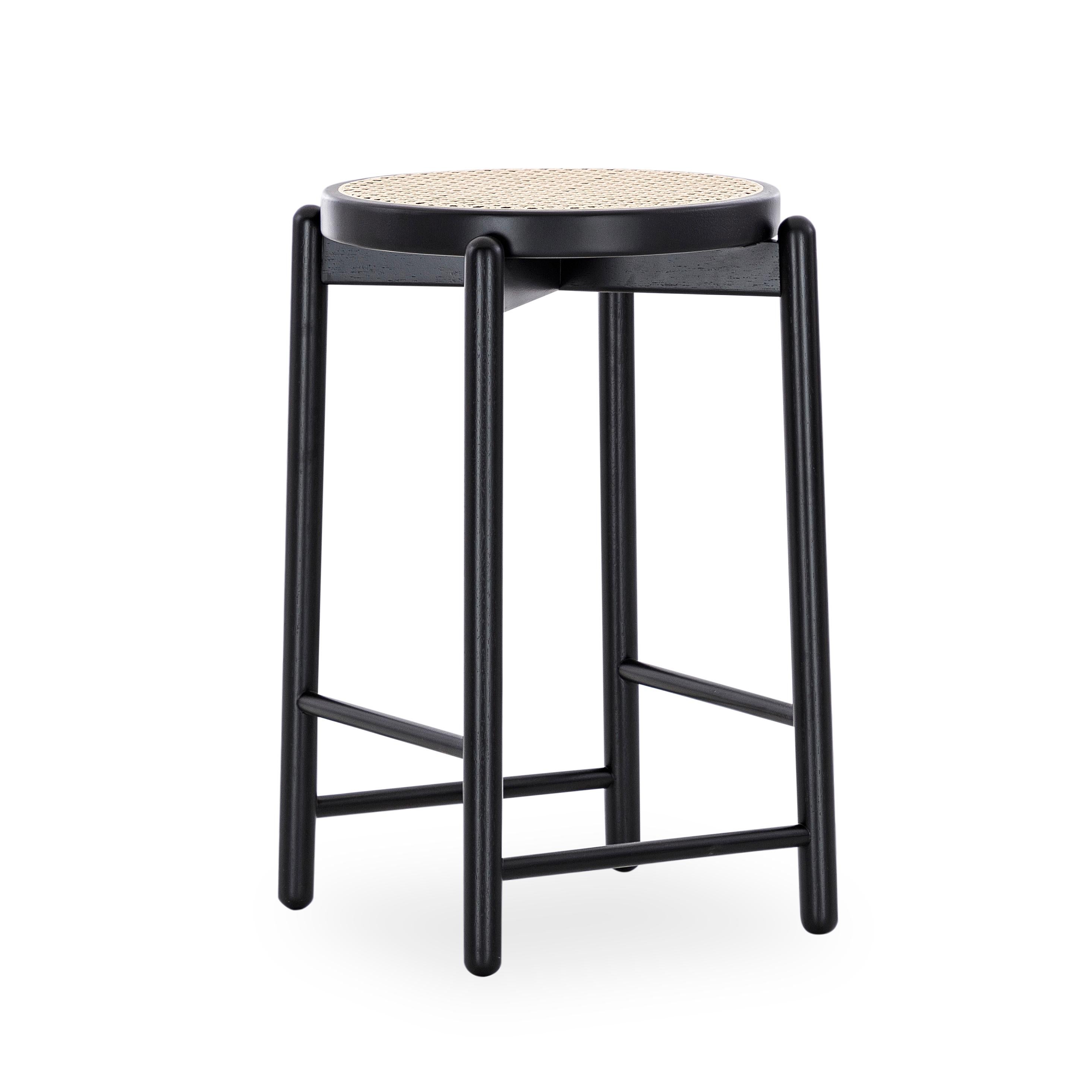 Our Uultis team has designed this Maru counter stool in a black wood base with a cane seat that it will stop being only a decoration counter stool to become part of the day-to-day lives of those who experience enriching cultural activities. The Maru