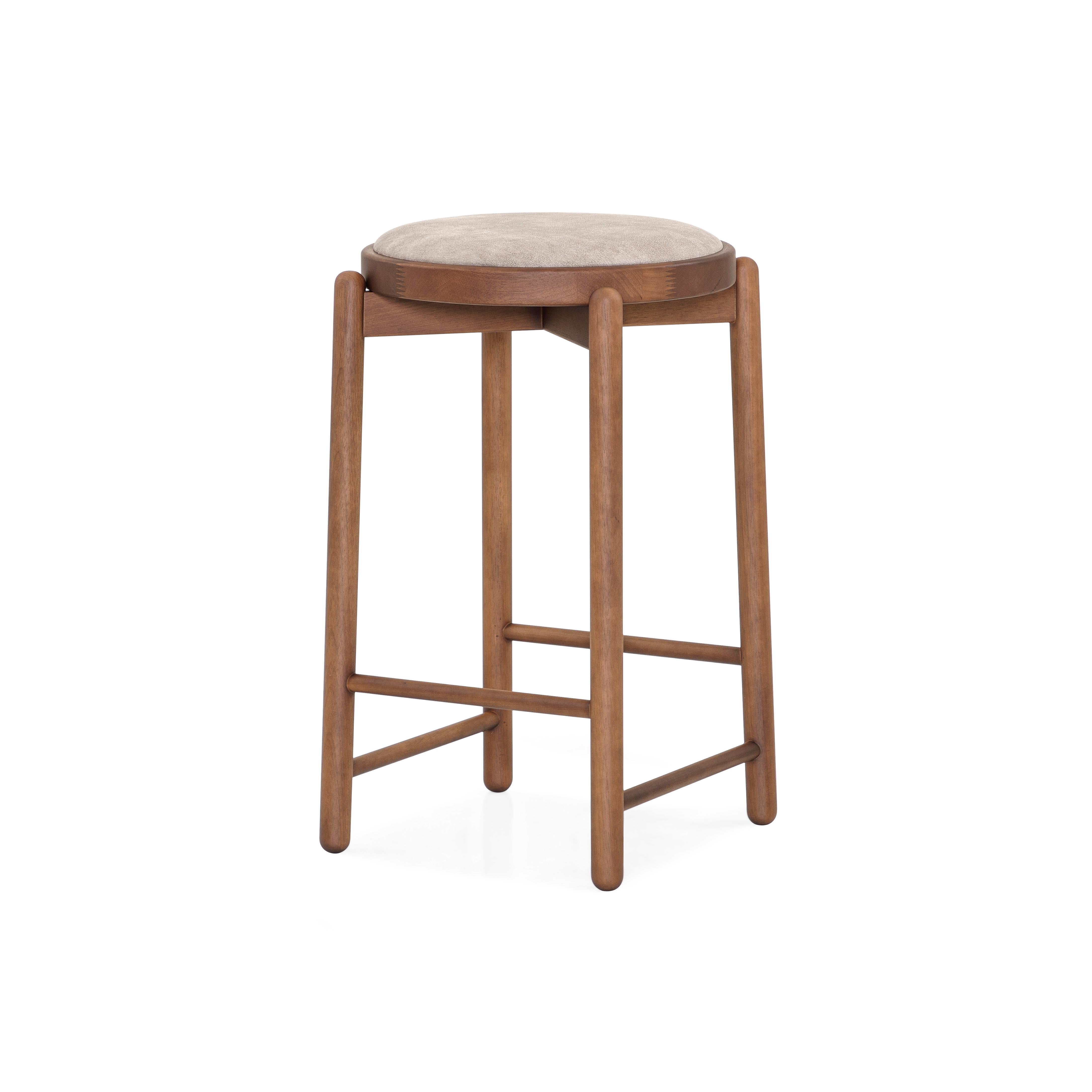 Our Uultis team has designed this Maru counter stool in a walnut wood base with a matching upholstered cushioned seat that will stop being only a decoration counter stool to become part of the day-to-day lives of those who experience enriching