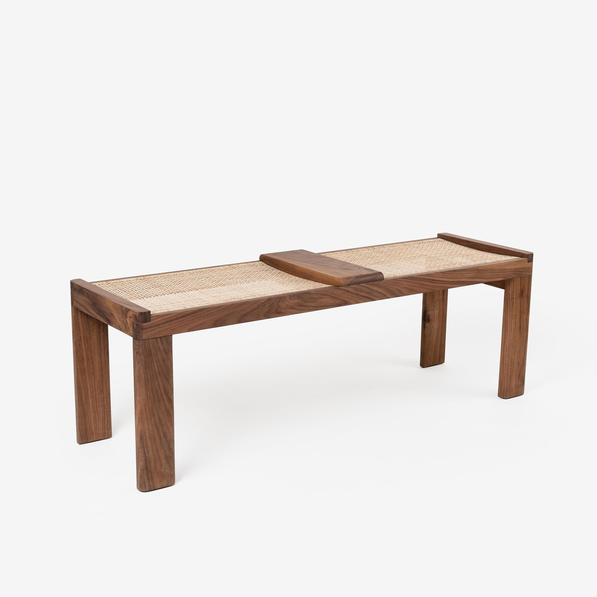 Mārum Bench with Cane Weaving by Murubi
Dimensions: W 137.5 x D 41.5 x H 46.5 cm. 
Materials: Teak Wood & Walnut Wood. 
Wood & Finish: Walnut. 

Also available in different finishes: Teak Wood & Walnut Wood. 

Murubi is a contemporary design-driven