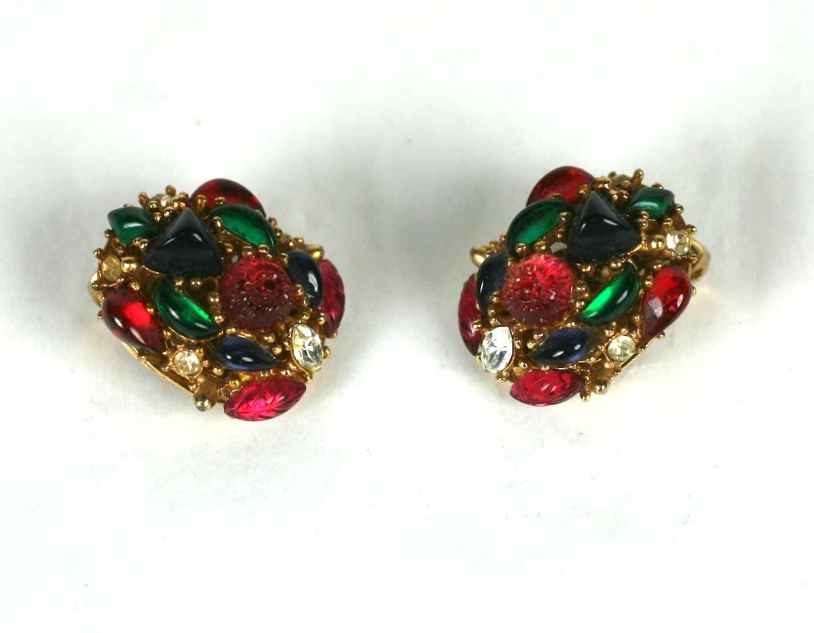 Marvella tri color fruit salad oval ear clips set in gold plate metal. Molded faux ruby, emerald and sapphire fruit salad stones are accented by crystal rhinestones.
Excellent Condition, Clip back fittings
Length .75
