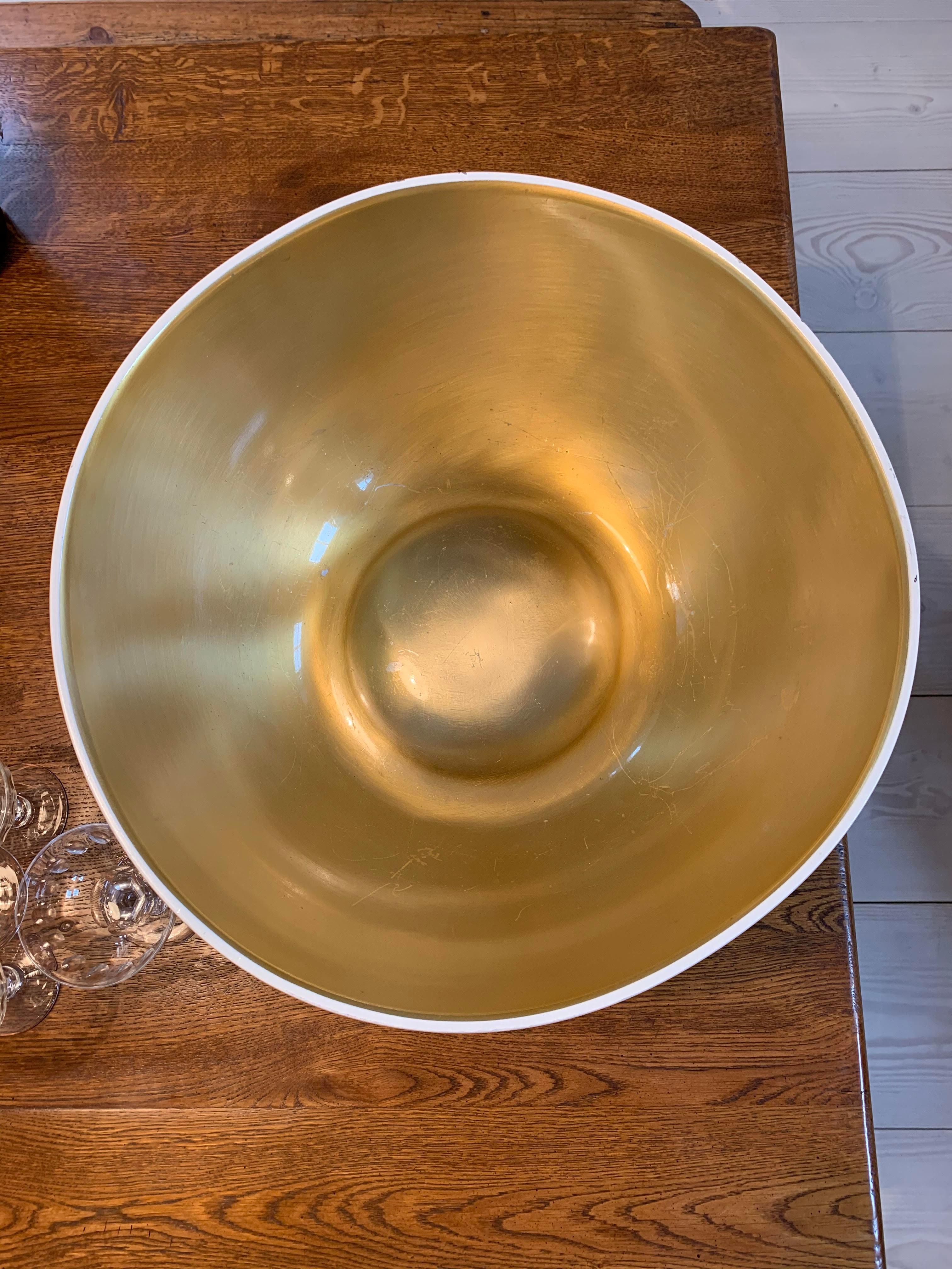 Marvellous Grand Model champagne cooler in tin, from the prominent champagne house Moët & Chandon, with the outer bowl in white paint and a brass look inner.

Special edition champagne coolers from Moët & Chandons were made for their ICE Imperial,
