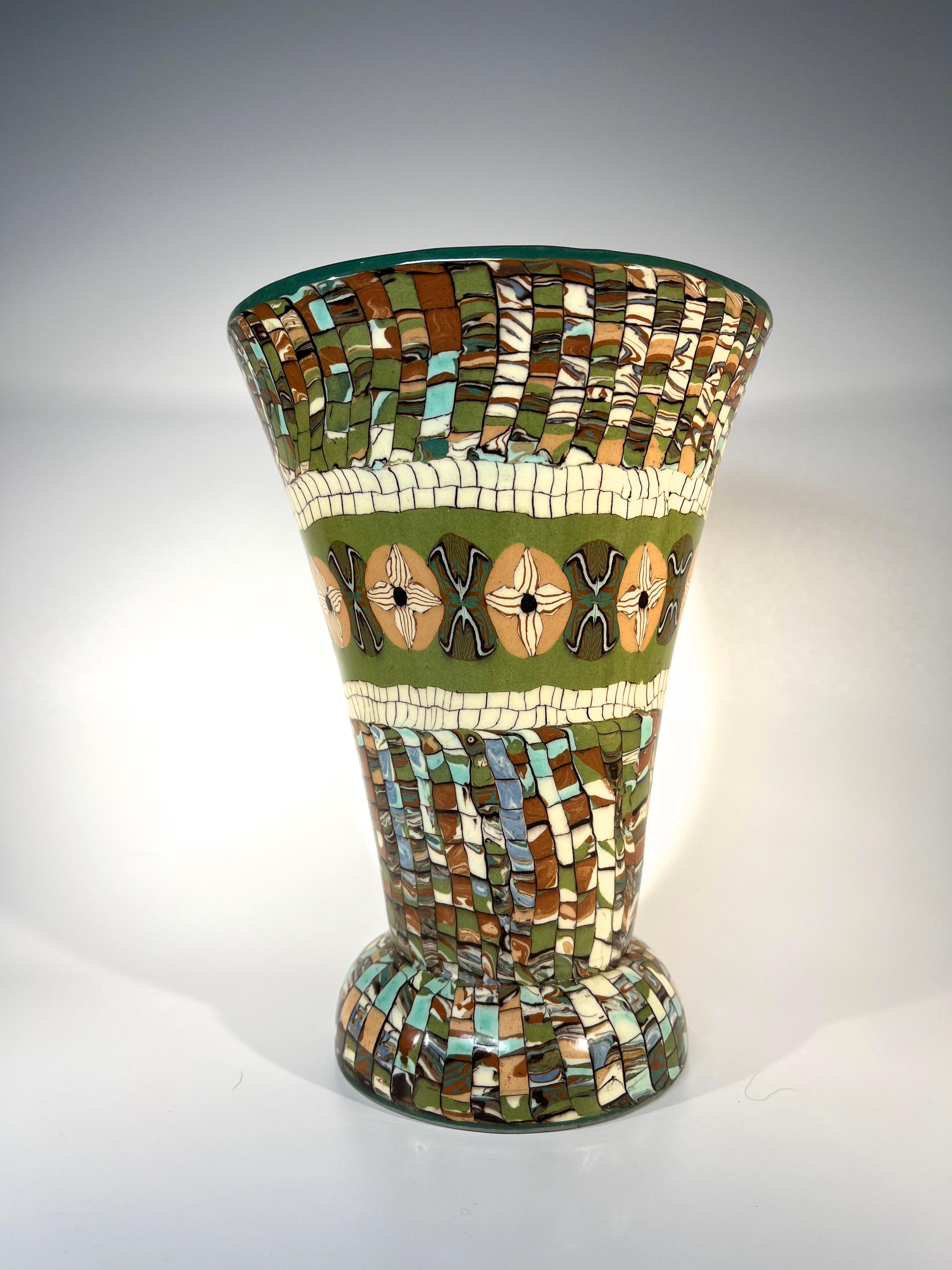 Created by the master ceramicist Jean Gerbino for Vallauris, a superbly designed flared shaped vase with mosaic patterning in tones of leaf green, sage, sand and cream
Circa 1960's
Signed Gerbino and Vallauris to base
Height 7.75 inch, Diameter 5.75