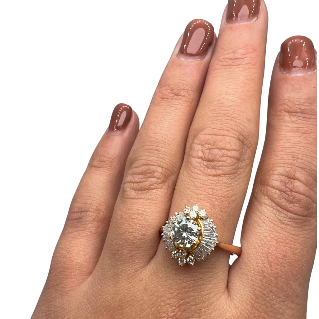 A stylish cluster ring with a dazzling 0.71-carat round brilliant natural diamond. It has 0.75 carats of side diamonds which add more to its elegance. The jewelry is made of 14K Rose Gold with a high-quality polish. It comes with a GIA certificate