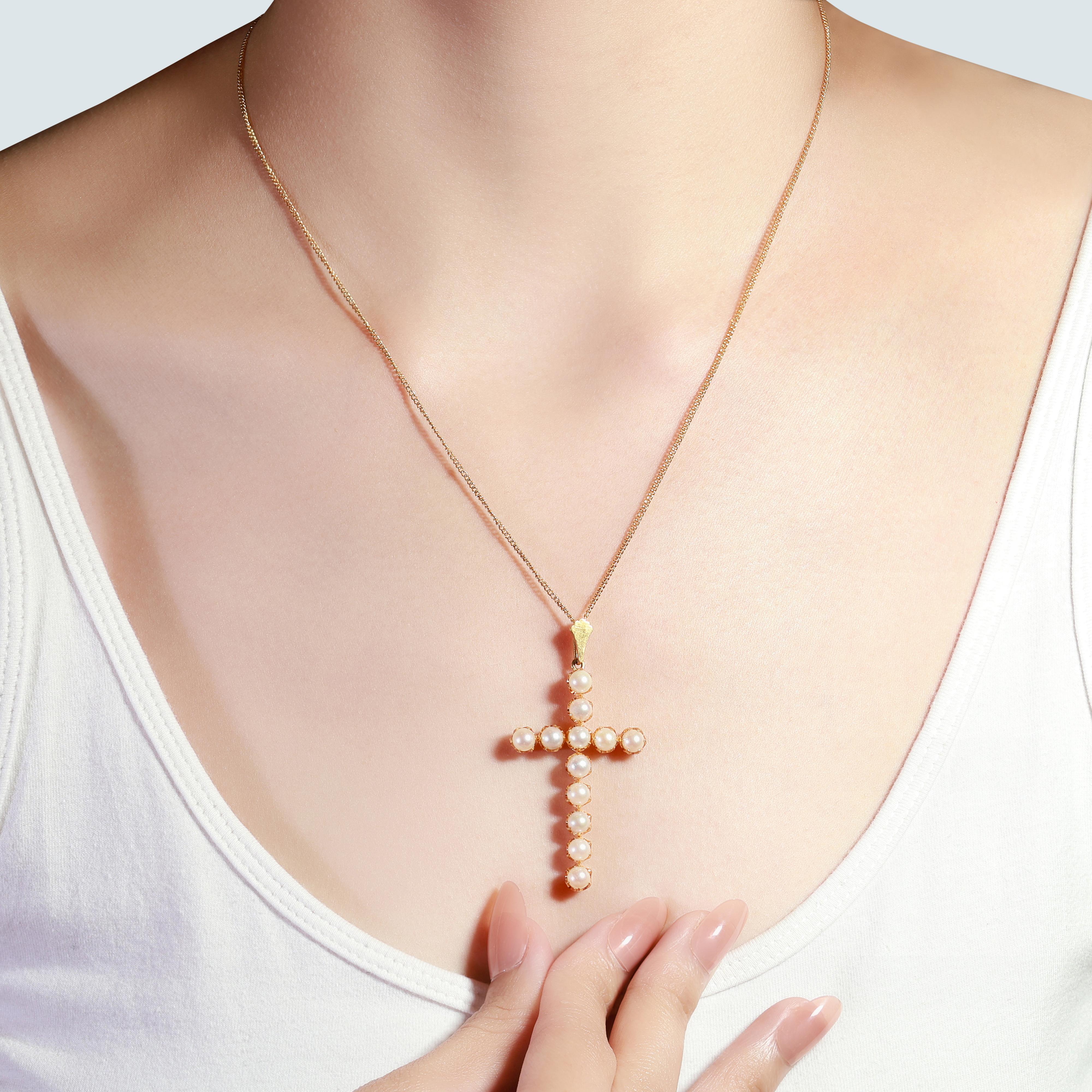 A sparkling cross necklace with pendant with a dazzling 0.02 carat  pearls. The jewelry is made of 18k yellow gold with a high quality polish. It comes with a fancy jewelry box.

Product Details:

Metal: 18K Yellow Gold

Main stone: 
12pcs. Natural
