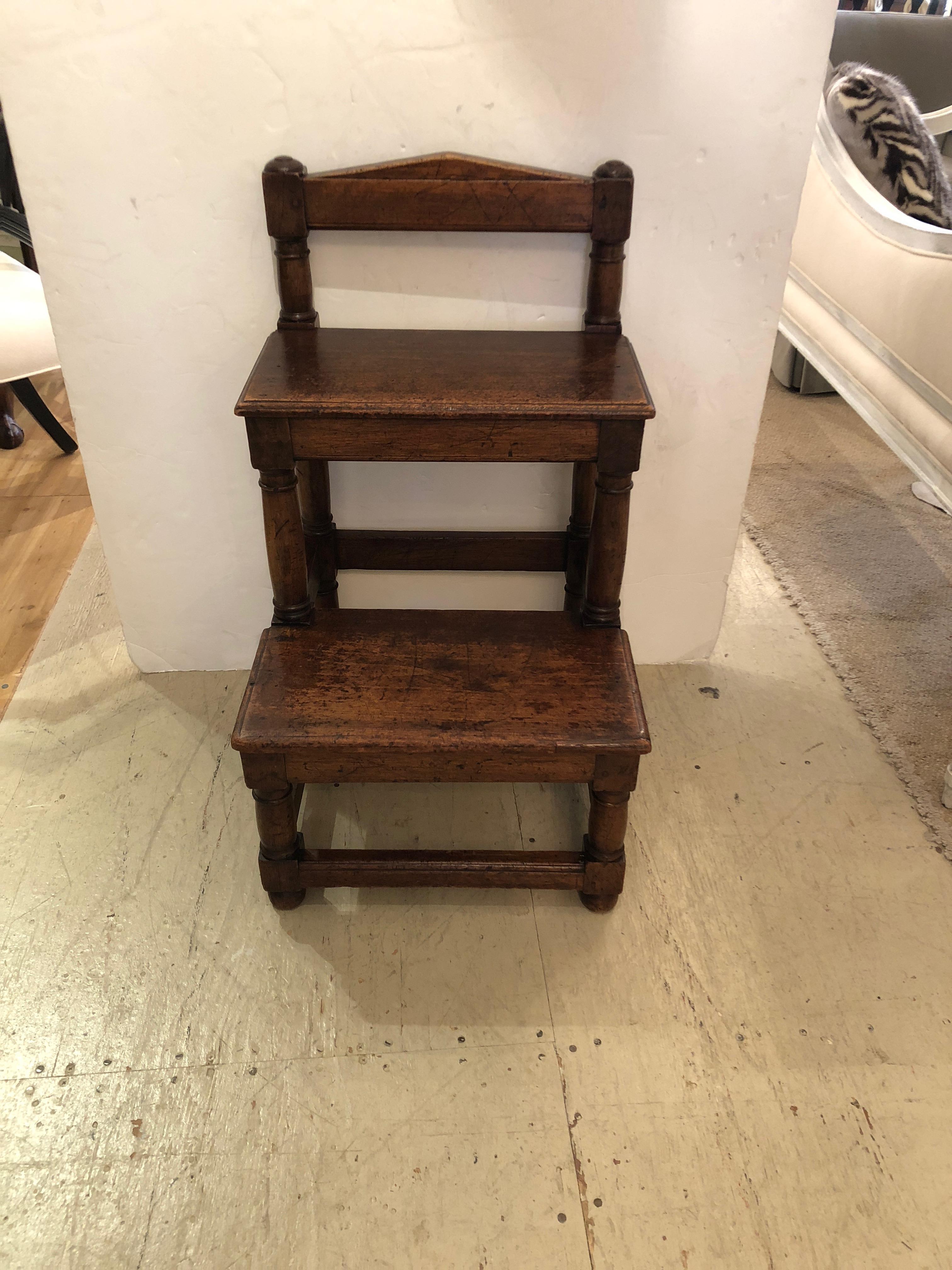 Wonderful antique English fruitwood library steps having two solid risers and substantial pegged construction.