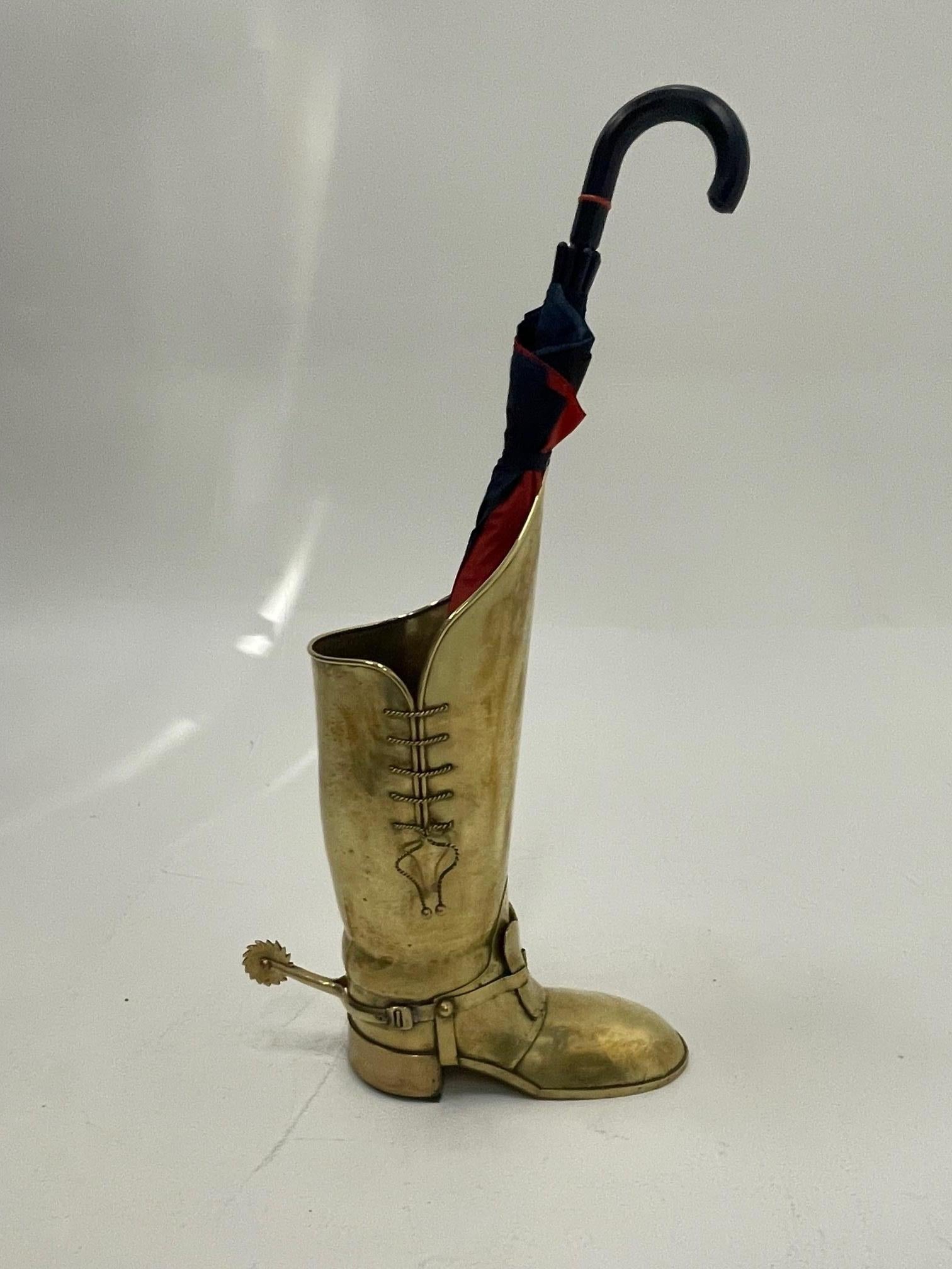 Marvelously crafted hand made polished brass umbrella stand in the shape of a handsome boot with incredible details including spiky spur, laces, and buckles. Made in Italy stamped on bottom.