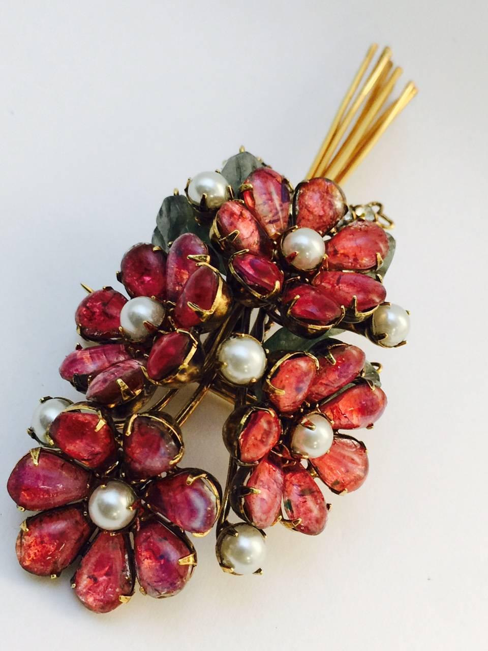 Vintage Iradj Moini Flower Bouquet Brooch is an unforgettable, statement piece! Features mottled pink pear shape petals, nine 5mm pearls, carved resin leaves and rhinestones. Brooch measures 4.5