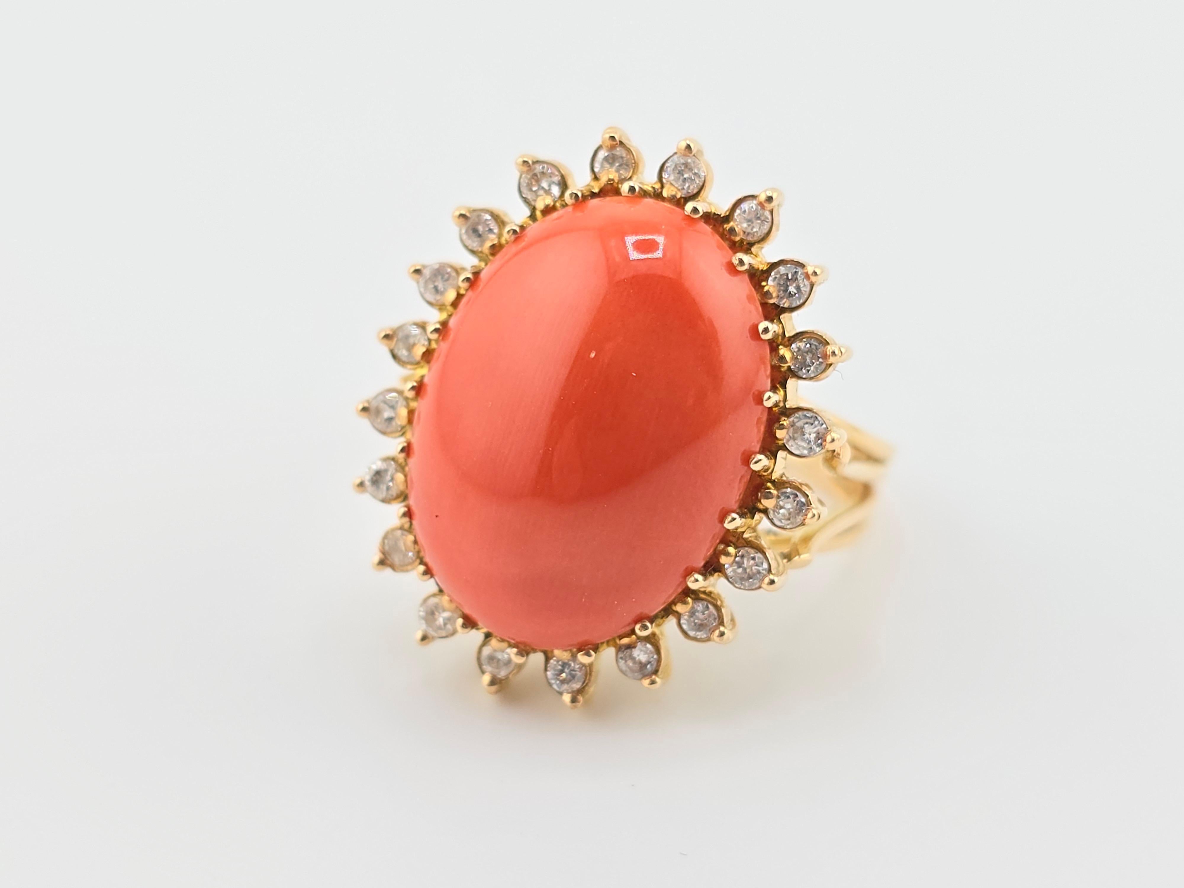 This is an exceptional, gorgeous Italian momo coral gold ring. It is surrounded with many diamonds to give it even more of a gorgeous sparkle. The color of the coral is natural and has not been dyed or processed like many other corals in the market.