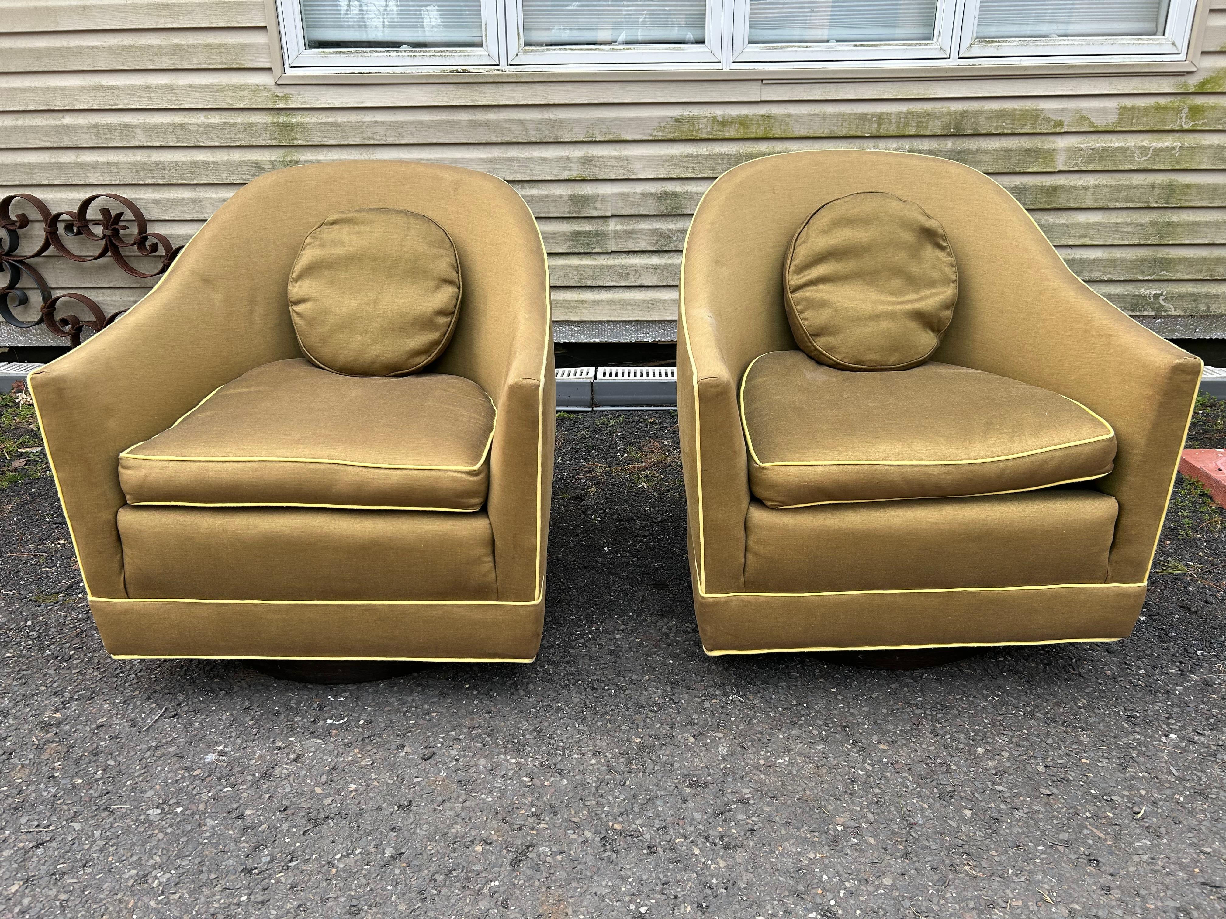Marvelous pair of Harvey Probber barrel back club chairs on wooden swivel platform bases.  We love the original small round back cushion.  Chairs looks to have been reupholstered in the past but needs to be refreshed.  These measure 31