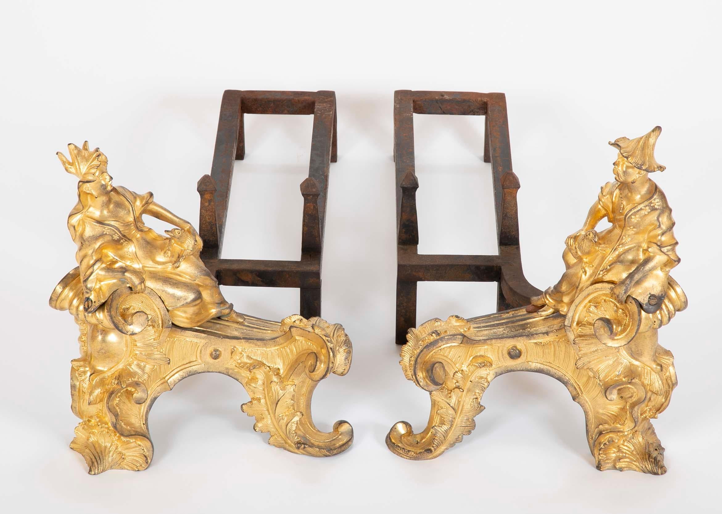 Pair of period Louis XV dore bronze Chenets. Depicting male and female chinoiserie figures.