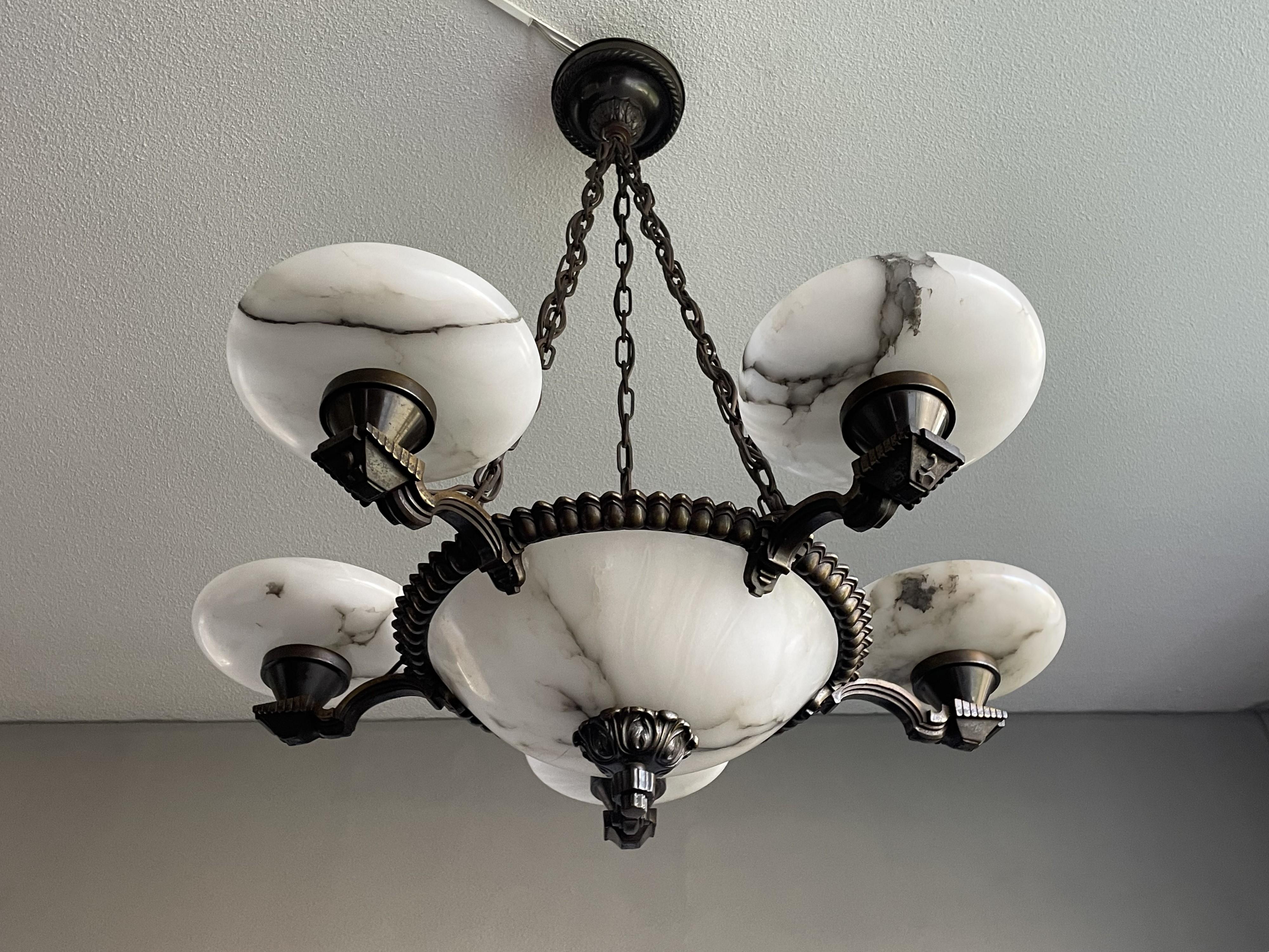 Striking and practical size alabaster pendant light for the perfect atmosphere.

If you are looking for a stylish and ready to use chandelier to grace your living space then this antique Art Deco specimen from the earliest years of the 20th century