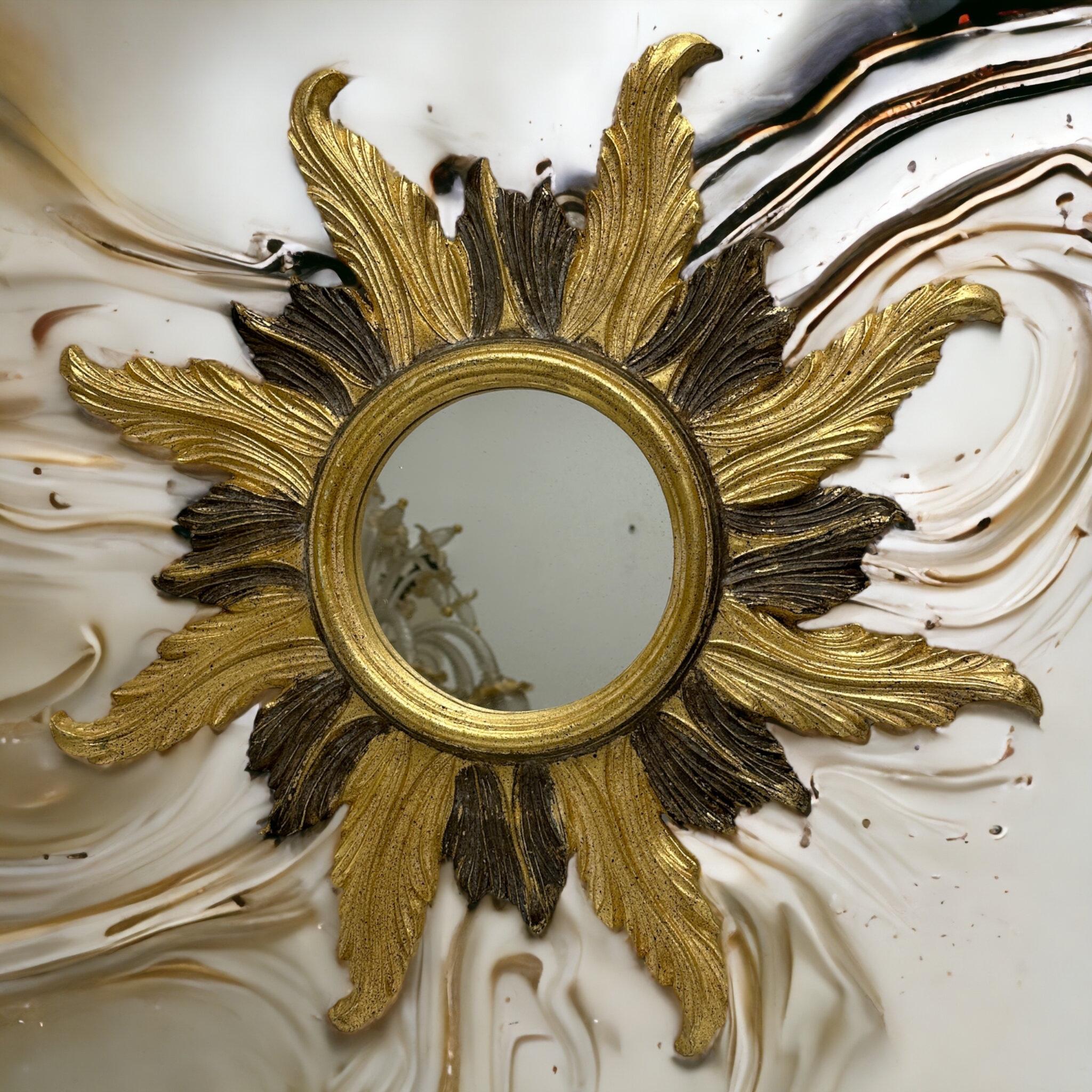 A beautiful starburst sunburst mirror. Made of gilded composition and wood. It measures approximate 22.38