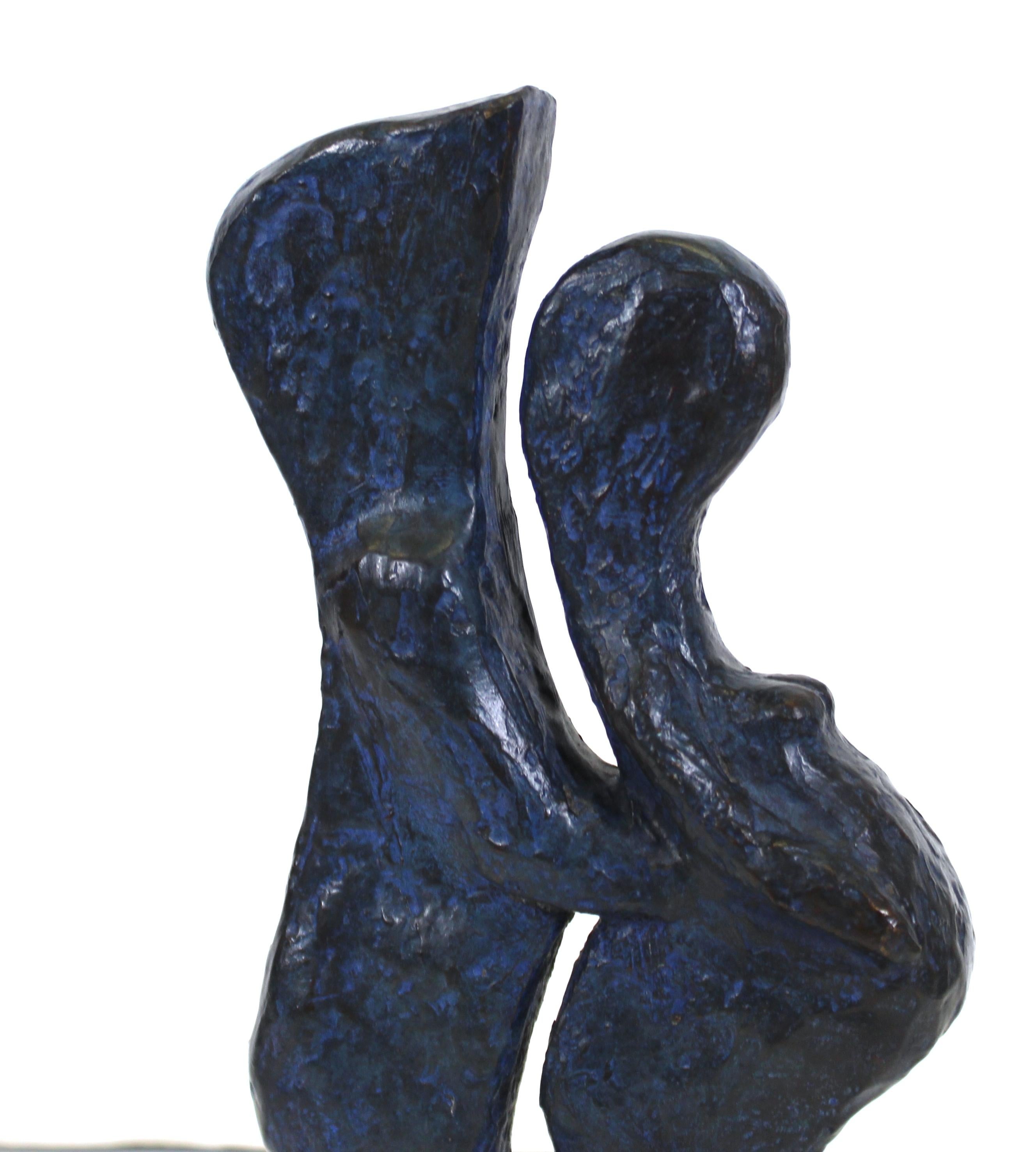 Modern abstract bronze sculpture of a couple in embrace, the woman appearing pregnant, sculpted by American artist Marvin Bell in 1984. The piece is signed and dated on the base and has the foundry name 'Roma Bronze Works' and edition number '1/21'.