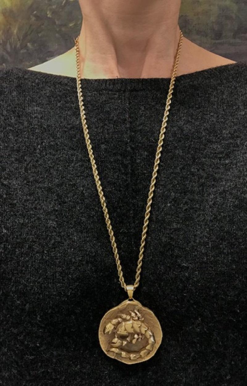 This vintage 14k gold Scorpio pendant by Marvin Hime is a bold and thoughtful take on astrological symbolism. The pendant is marked “after Rodin” on the reverse, hinting at its sculptural roots. The Scorpio figure is rendered in high relief, curving