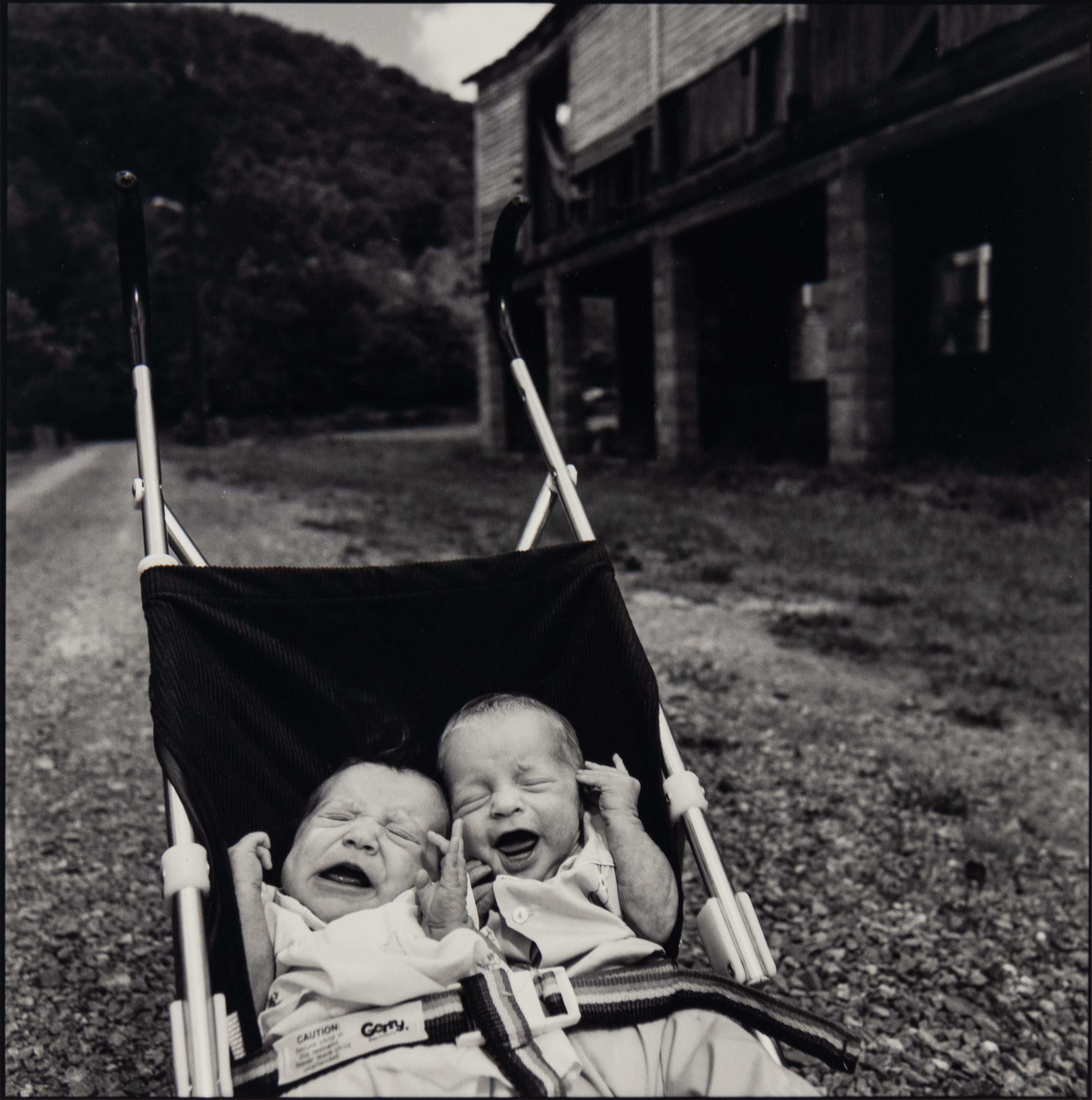 A black and white photography by Mary Ellen Mark of two crying twins in Middleboro, KY in 1988.

Signed

Archival pigment print

14 x 11 inches, sheet
10.5 x 10.5 inches, image