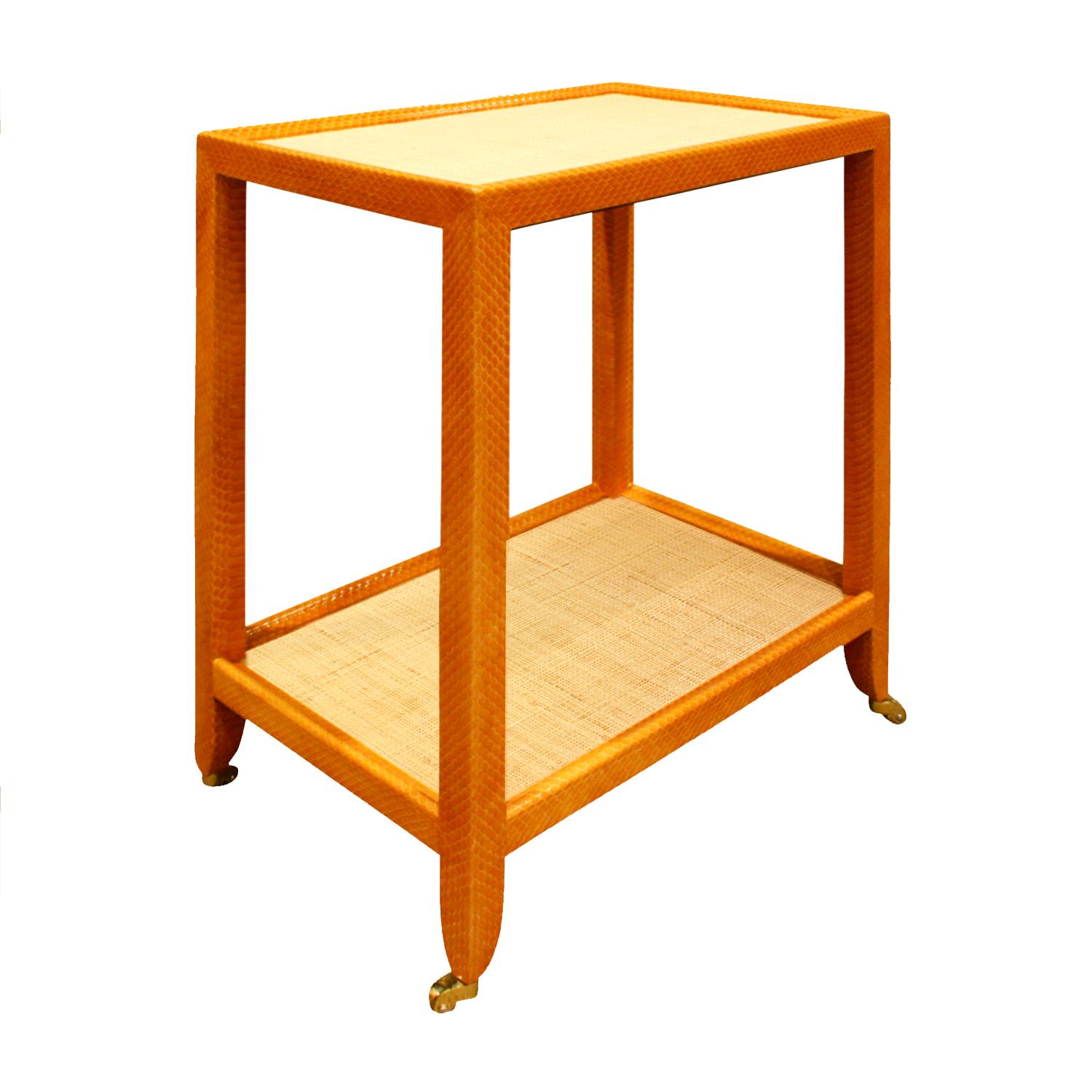 Telephone table covered in apricot python with natural Madagascar cloth tops on polished brass castors by Mary Forssberg, American 2019 (signed). This table is meticulously crafted and the combination of materials is very chic.