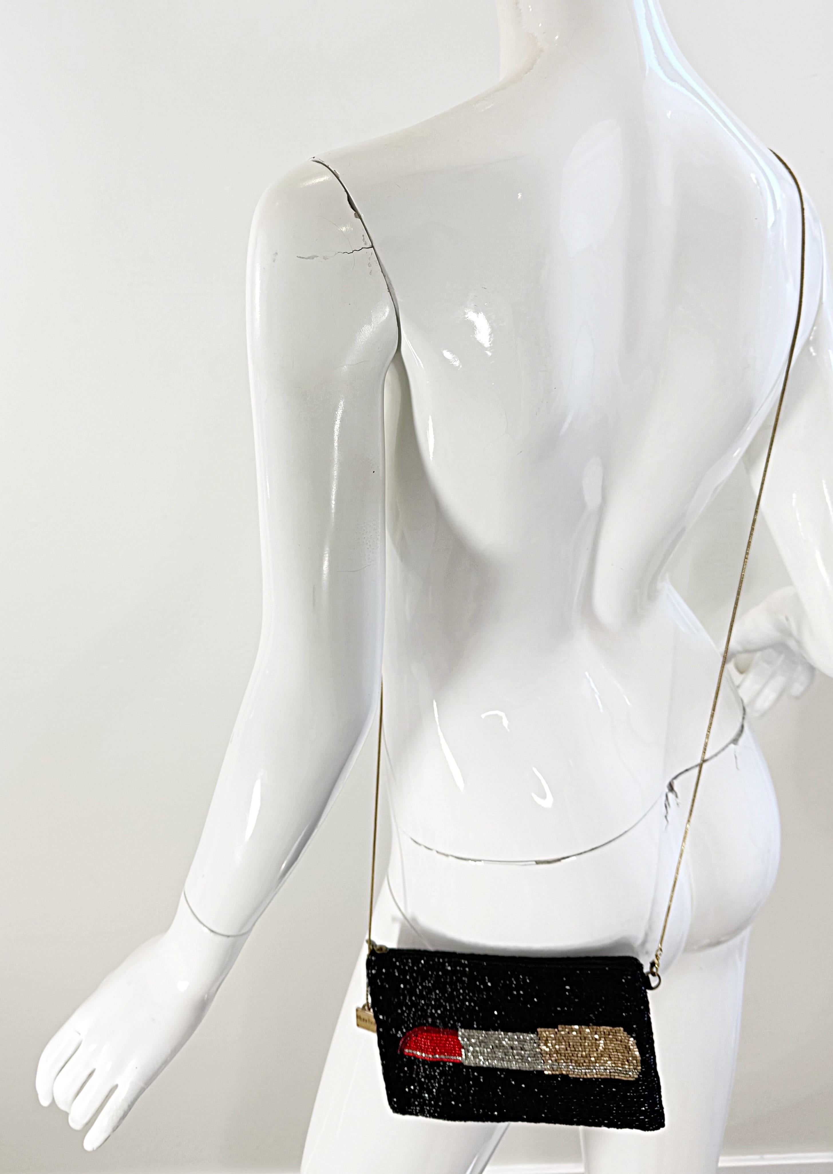 Chic and super versatile early 2000s Y2K Mary Frances beaded lipstick novelty bag ! This practical bag can be worn three ways with the adjustable removable strap: East/West, North/South, or as a clutch. Thousands of hand-sewn seed beads in black,