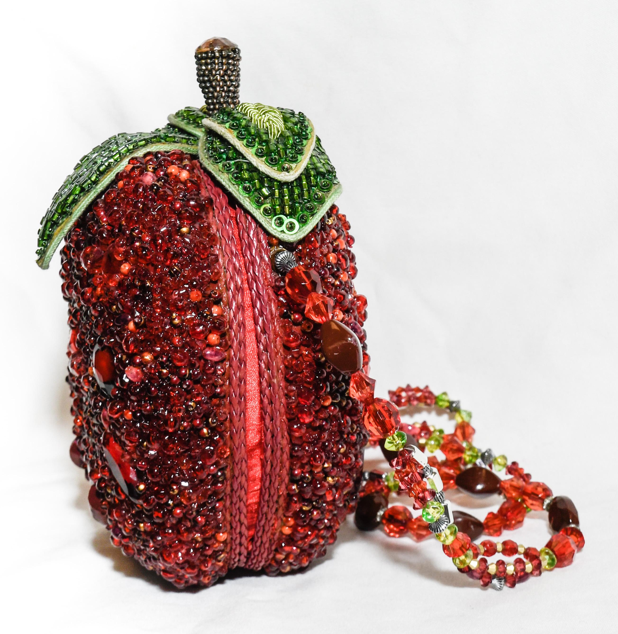 Mary Frances candy apple red shoulder bag heavily decorated with red beads fuse whimsy with elegance, femininity with functionality. Richly embellished with opulent natural stones, rhinestones, studs, beads, crystals and trims from all over the