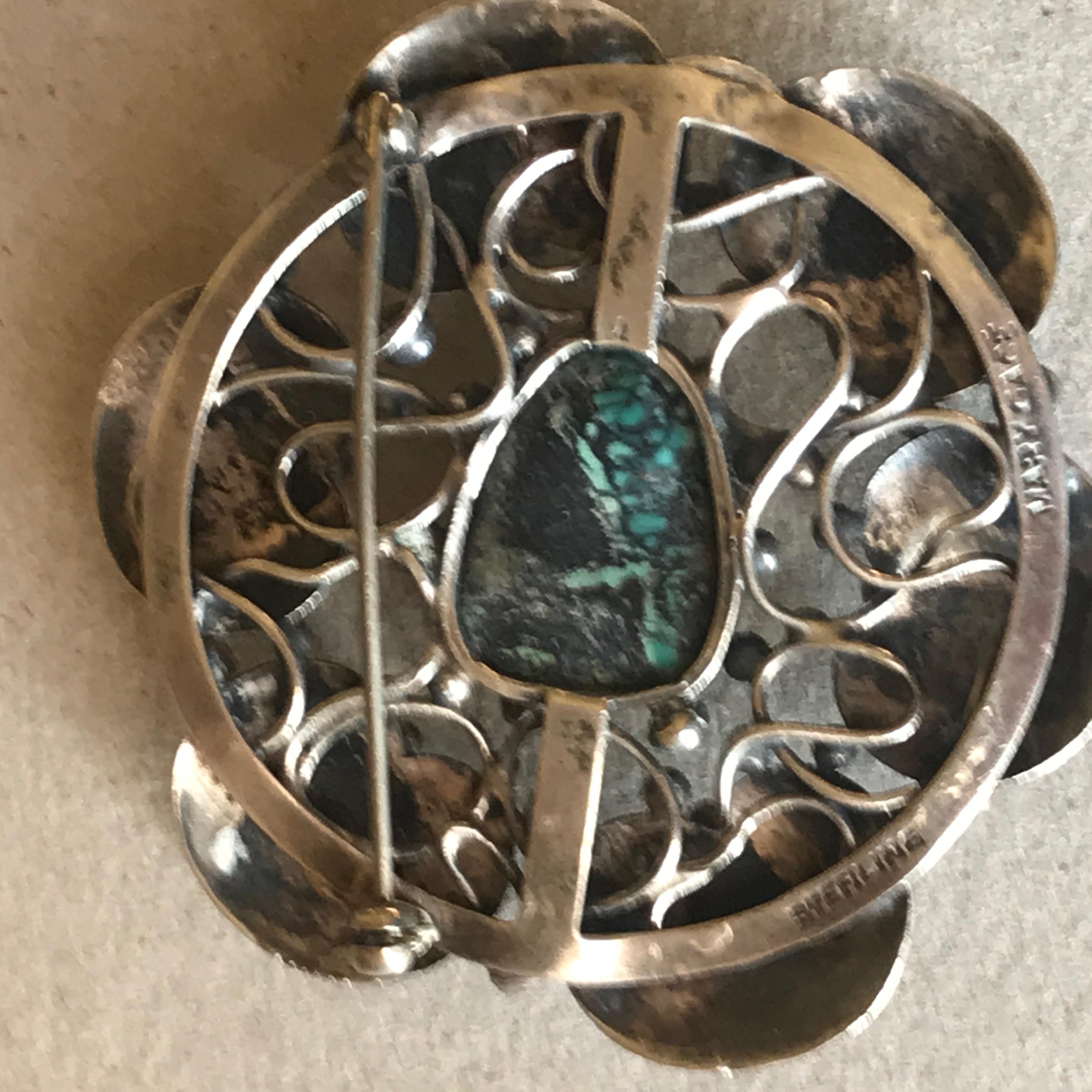 Lily pad sterling silver brooch with turquoise by Mary Gage. 
Complimentary gift box included with purchase.

Mary Gage (1898-1993) was born in Indiana. She served as a nurse during World War I. After the war she traveled around the world, with two