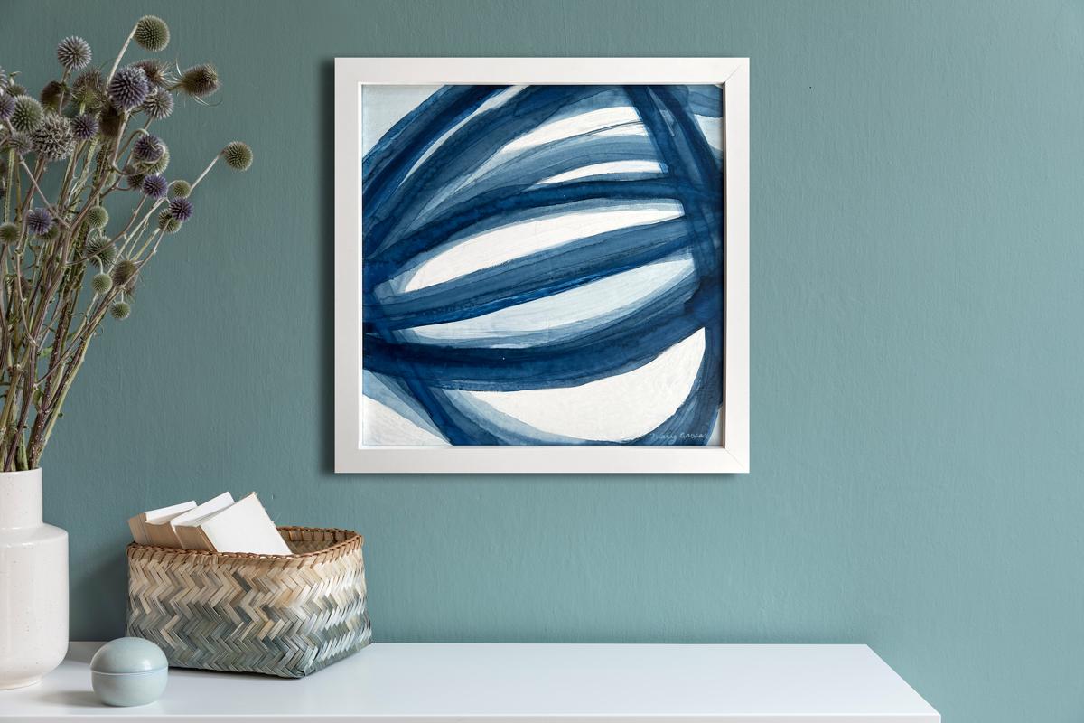 This abstract painting by Mary Gaspar features a cool blue and white palette. The artist organically moves a wash of acrylic and watercolor paint across the canvas in strokes to create what she calls, 