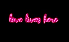 love lives here - neon art work