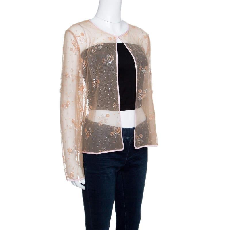 Diese hübsche durchsichtige Jacke gehört zur Frühjahr-Sommer-Kollektion 2015 von Mary Katrantzou. Diese bezaubernde Kreation, die Weiblichkeit und Stil ausstrahlt, ist aus Tüll gefertigt und mit floralen Glitzer-Verzierungen versehen. Kreieren Sie