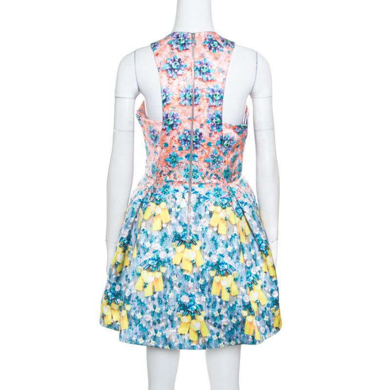This gorgeous Silverfloss Ohara dress from Mary Katrantzou is what your wardrobe has been missing all this while! It is made of 100% polyester and features a lovely bejeweled bow print all over it. It flaunts a flattering silhouette and comes with a