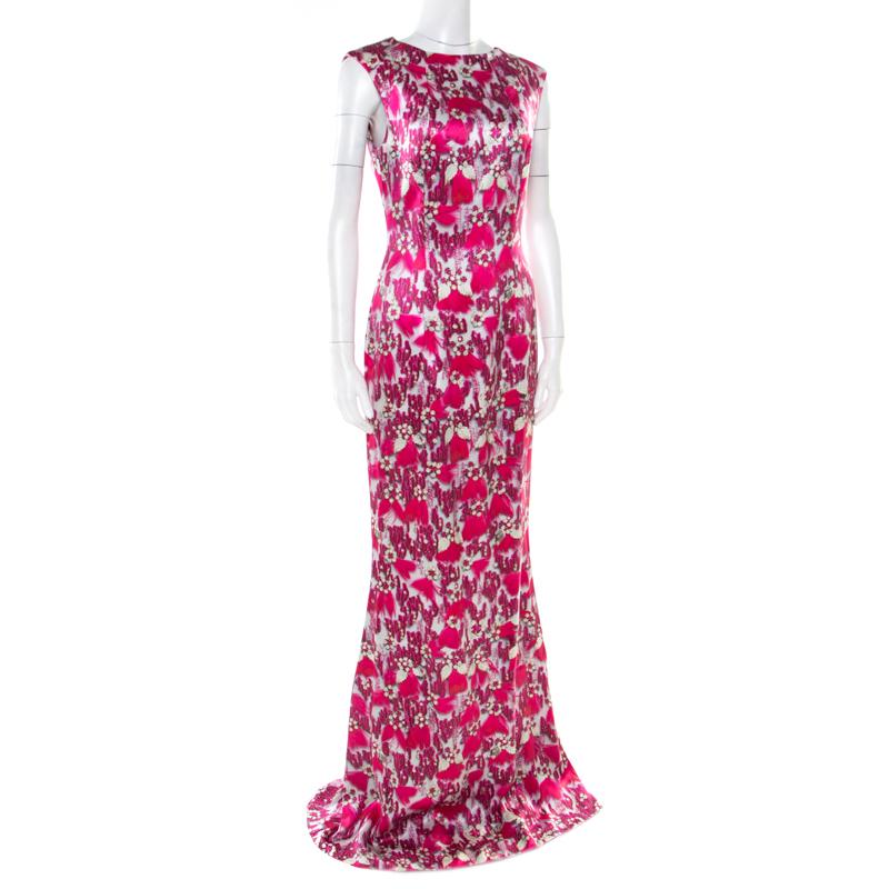 We've fallen in love with this gorgeous evening gown from Mary Katrantzou! The lovely fuchsia pink creation is made of 100% silk and features a bejewelled feather print all over it. It flaunts a bateau neckline and comes equipped with a concealed