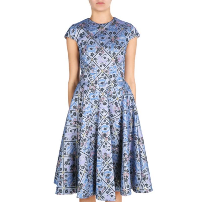 This princess-worthy dress by Mary Katrantzou is an absolute beauty. Its structured material has just the right shine and features a checkered print overlaid with floral and curved prints in shades of dark and light blue. Embellished with pink,