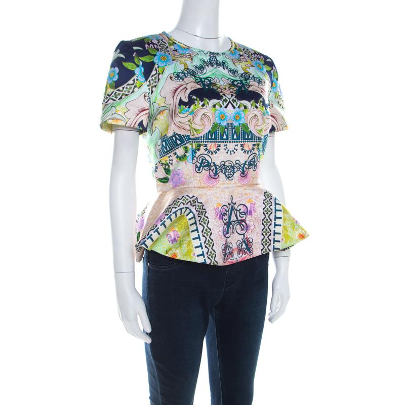 This top from Mary Katrantzou will surely be a closet darling. It is made from quality fabrics and styled with a round neckline, short sleeves and a back zipper. While the colourful prints give off a lively vibe, the peplum detail adds to the beauty