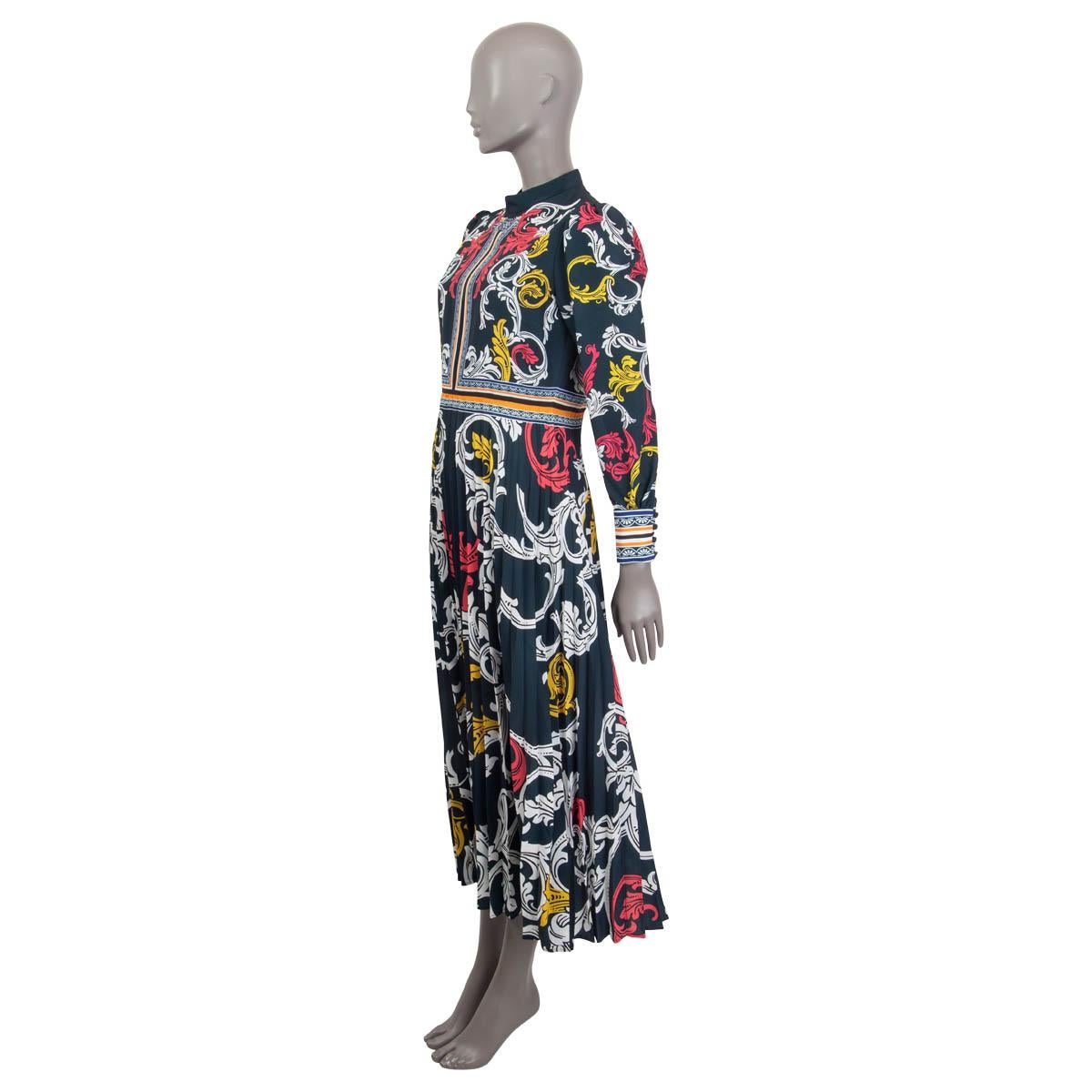 100% authentic Mary Katrantzou pleated maxi dress in midnight petrol, white, pink and yellow polyester (100%). Features long sleeves, a high neck and buttoned cuffs. Opens with a concealed zipper and two buttons on the back. Lined in midnight blue