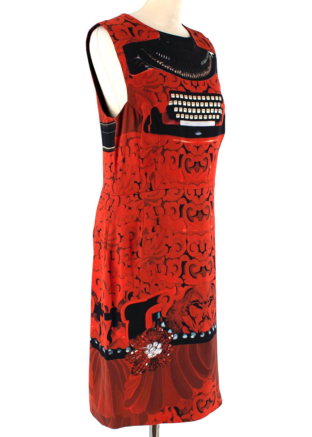 Mary Katrantzou Red Typewriter Print Shift Dress 

- Red & black pattern print 
- Sleeveless
- Shift style
- Invisible back zip fastening
- Round neck 
- Lined 
- Midi length  

Materials:
Main fabric:
- 100% Silk 
Lining:
- 98% Acetate 
- 2%