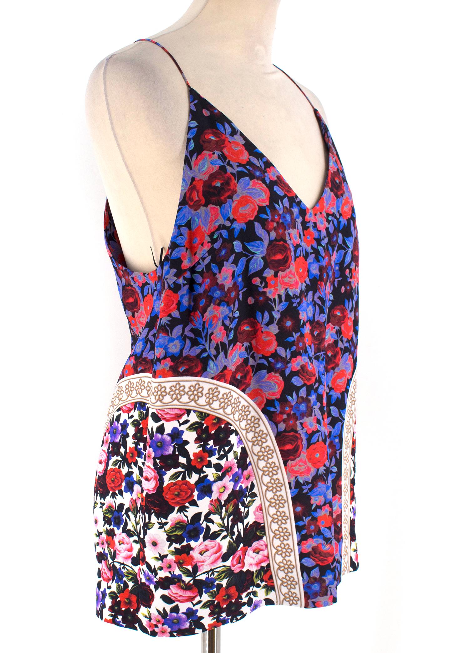 Mary Katrantzou Purple Floral Cami Top

-Purple silk cami top
-Features blue and red floral pattern
-V neck
-Spaghetti strap
-Racerback 

Please note, these items are pre-owned and may show signs of being stored even when unworn and unused. This is