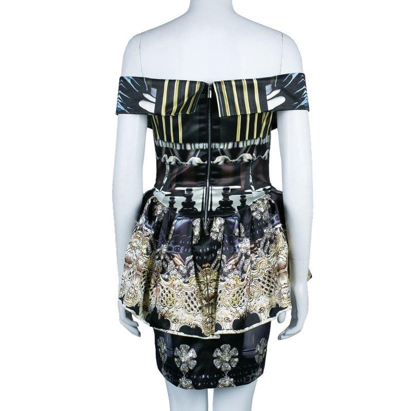 Irresistibly beautiful, this catchy dress by Mary Katrantzou is a spotlight winning dress. Crafted in silk, this printed dress is strapless and looks splendid in the peplum pattern at the waist. Wear this with high heel peep toes and get the perfect