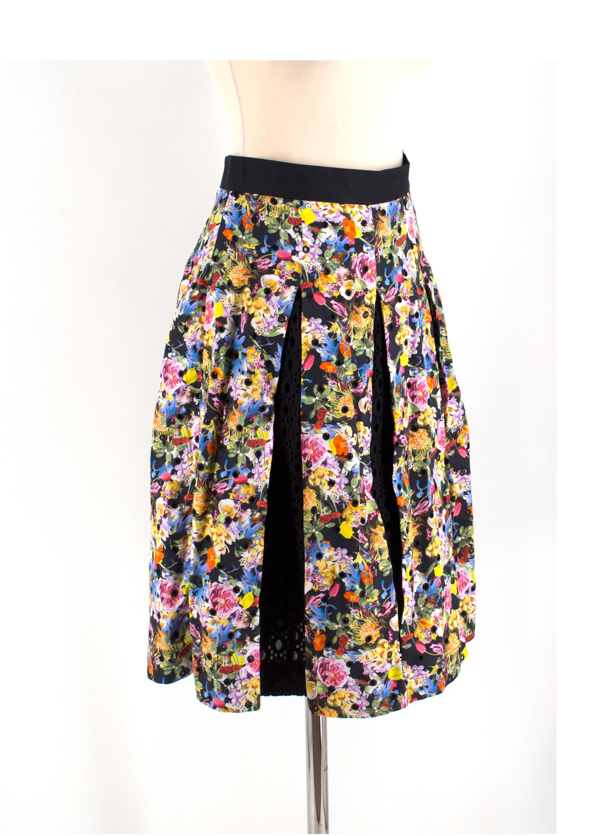 Mary Katrantzou Black Floral Crochet Midi Skirt

-Black skirt with multicoloured floral pattern
-Features black crochet panels
-Eyelet cut outs
-Side zip closure

Please note, these items are pre-owned and may show signs of being stored even when