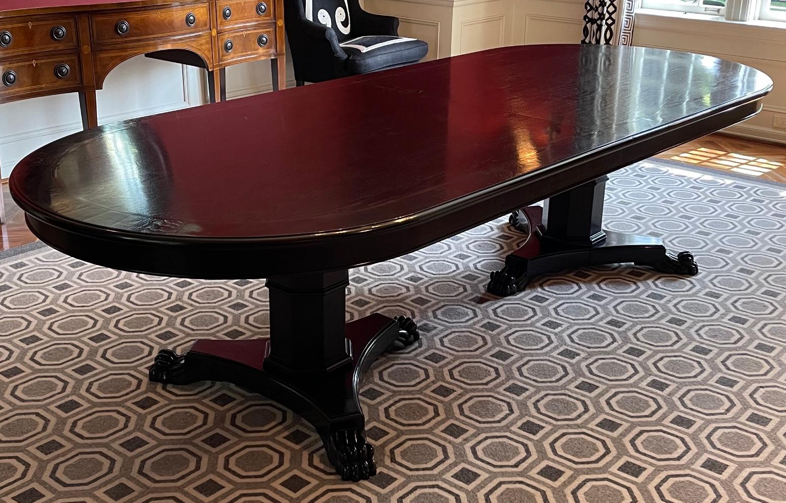 Mary McDonald Interiors 10’ Double Pedestal Regency Style Dining Table. This is the actual table featured in Mary McDonald’s book as illustrated in the pics.  It features an ebony finish with an inlaid rouge stripe and double pedestal base with paw