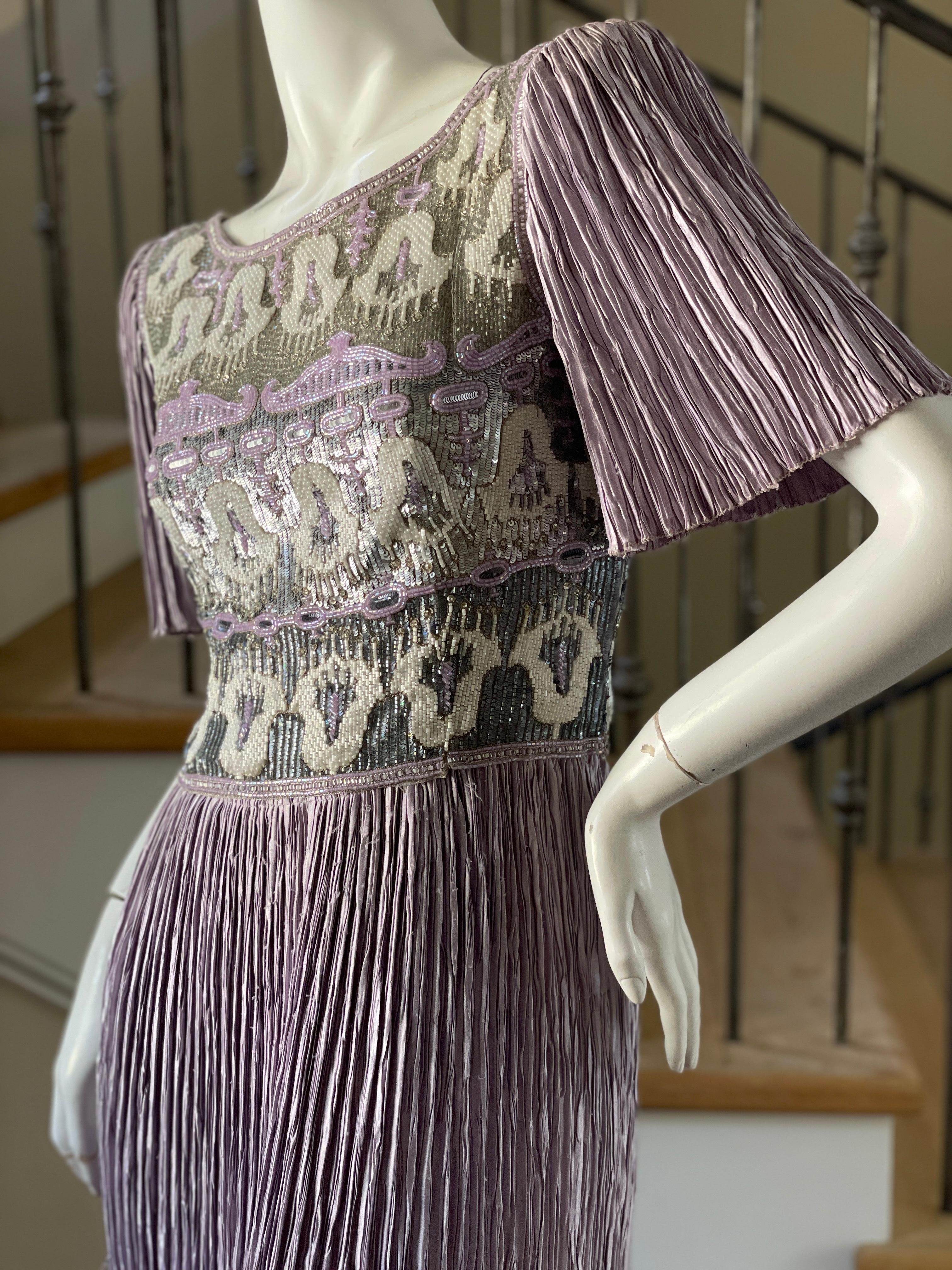 Mary McFadden Couture Vintage 1980's Lilac Pleated Beaded Evening Dress.
This is just so pretty, please use the zoom feature to see details.
Size 8
 Bust 38