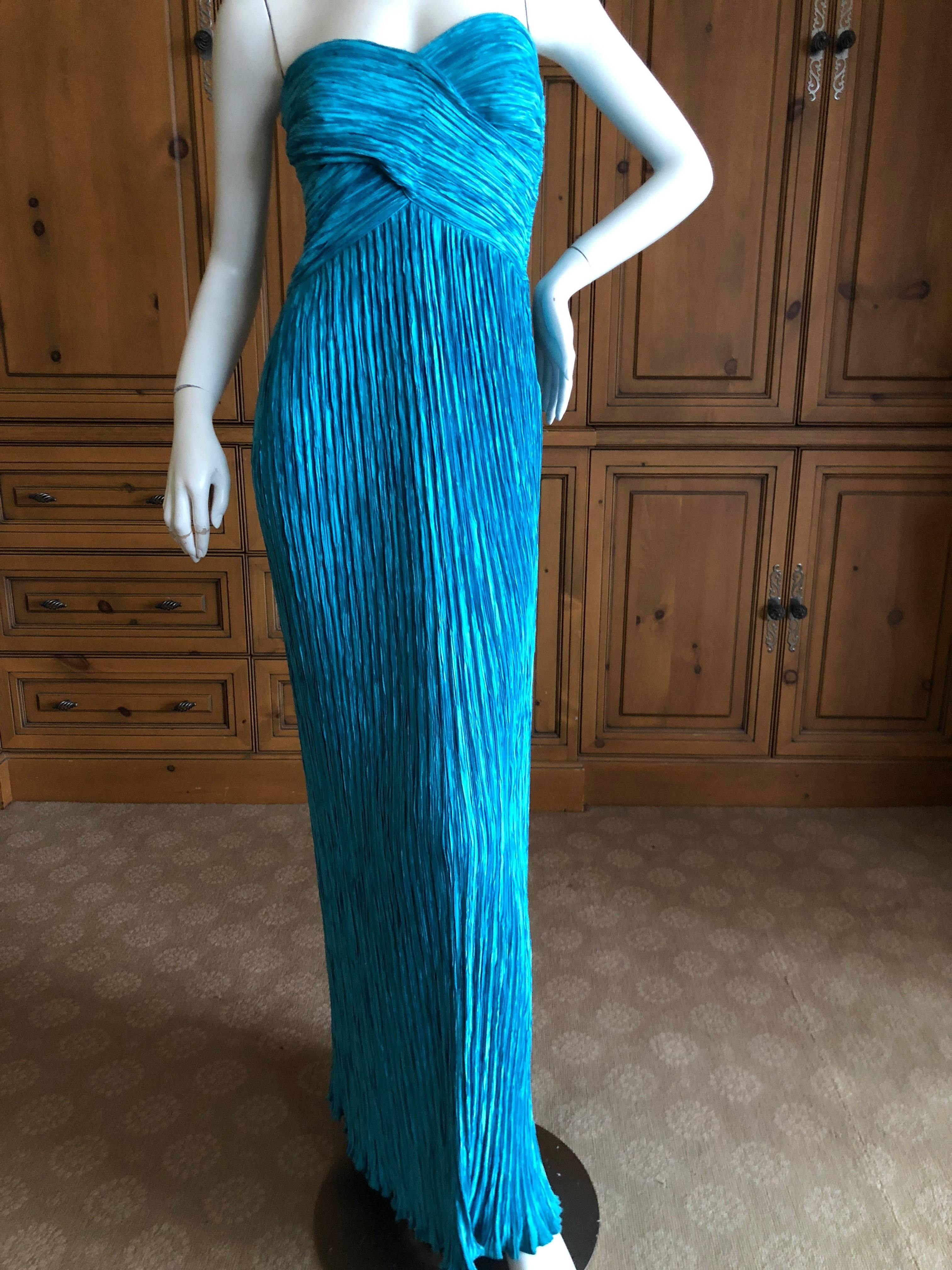 Beautiful turquoise pleated evening dress from Mary McFadden, circa 1970's.
Size Small
Bust 36