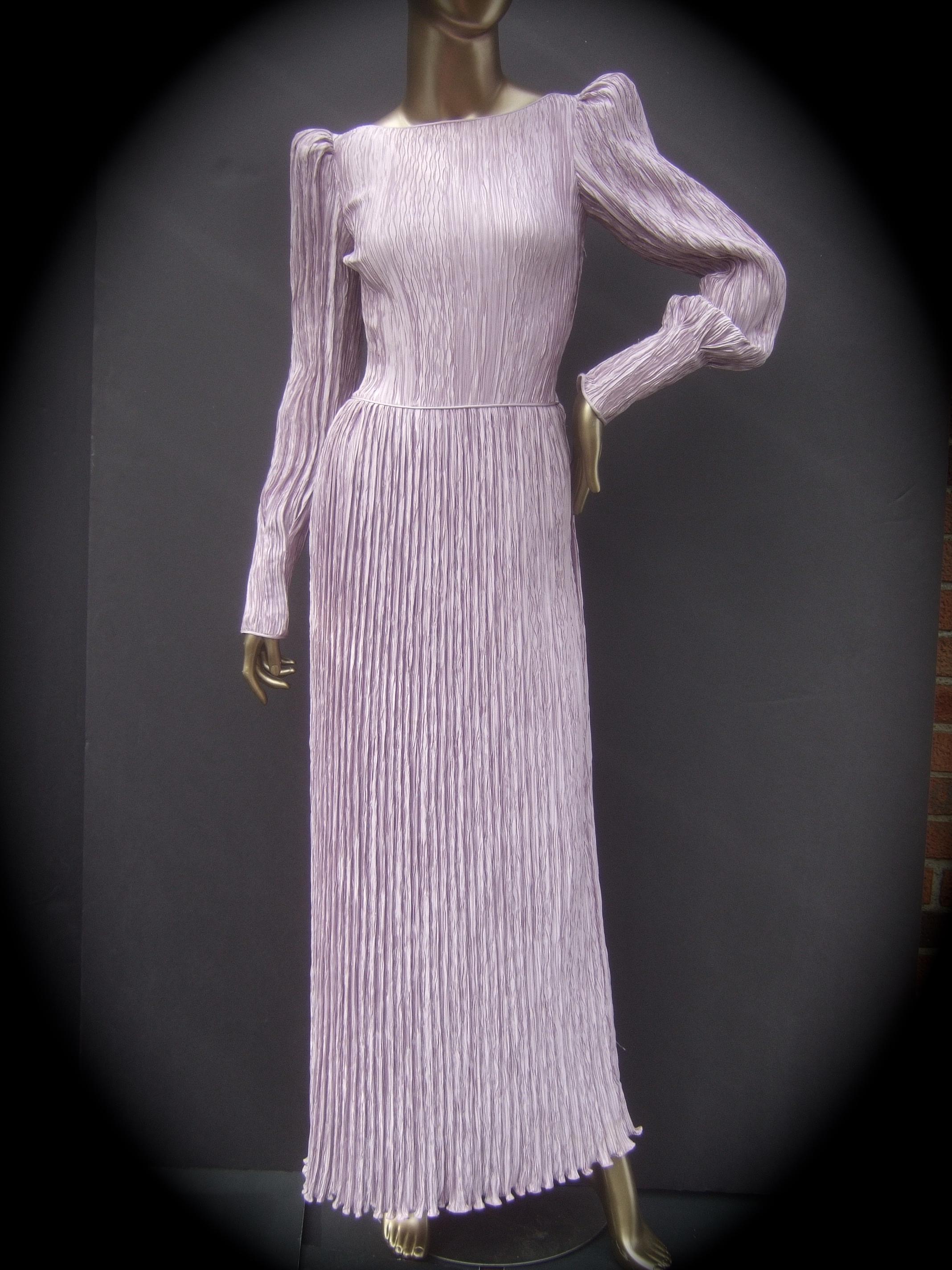 Mary McFadden Lavender pleated backless gown c 1990s
The exquisite pale lavender delphos pleated gown has a statuesque silhouette. The Fortuny 