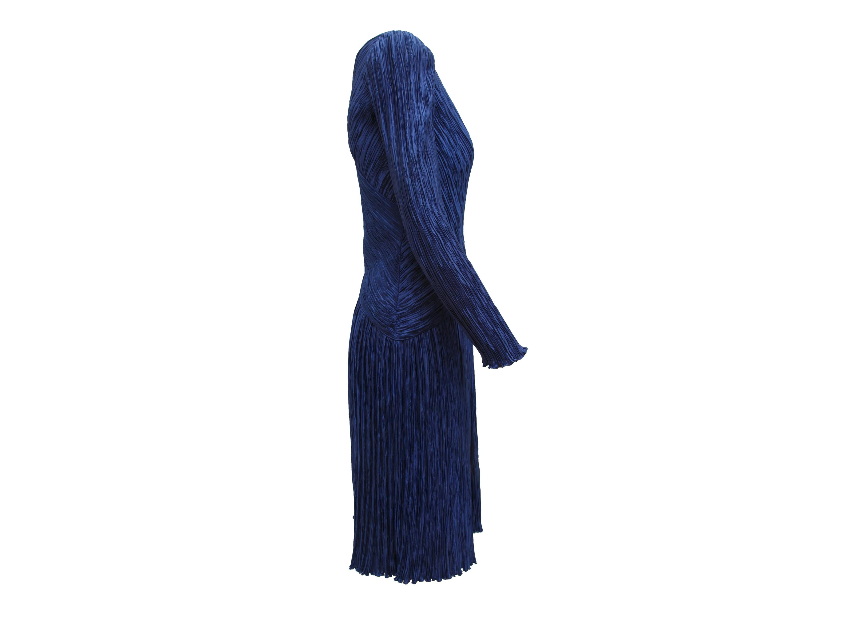 Product details:  Vintage navy blue pleated dress by Mary McFadden.  Double v-neck.  Long sleeves.  Concealed side zip closure.  36