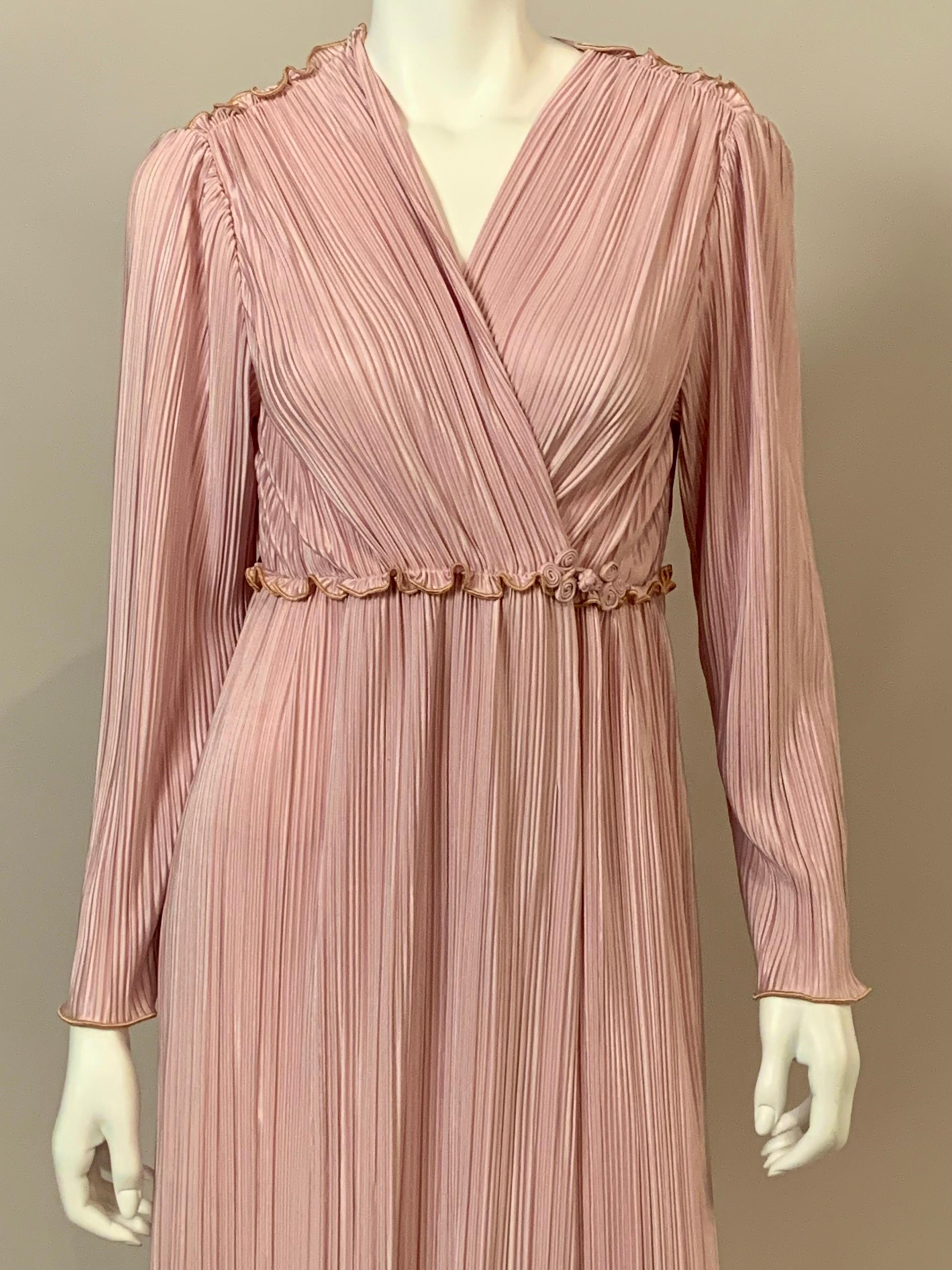 This ultra feminine pleated lilac robe from Mary McFadden is just stunning.  The slightly raised or Empire waistline  is accented with a ruffle and a left of center frog closure.  The ruffle is repeated on the shoulders and the ruffles are edged