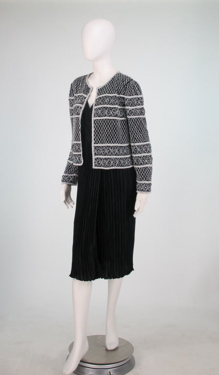 Mary McFadden black Fortuny style pleated wrap front plunge cocktail dress with matching black & white beaded jacket. The dress is sleek and sexy when worn with a narrow belt. Add the jacket for cool evenings,  black and white beads, pearls &