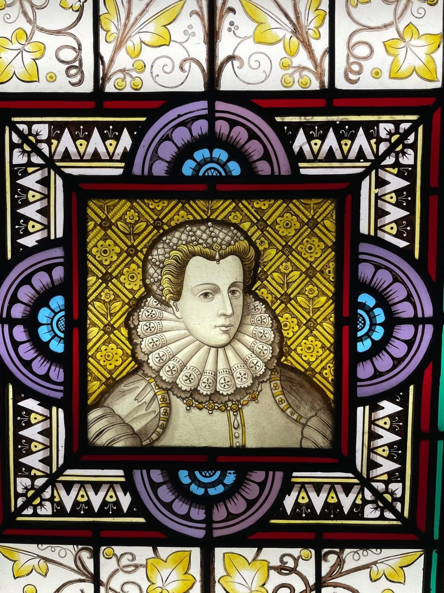 A late 19th century antique stained glass window panel depicting Mary Queen of Scots, one of 3 similar we are selling depicting notable figures of British history. At the centre is a distinguishable illustration of Mary Stuart, Queen of Scotland