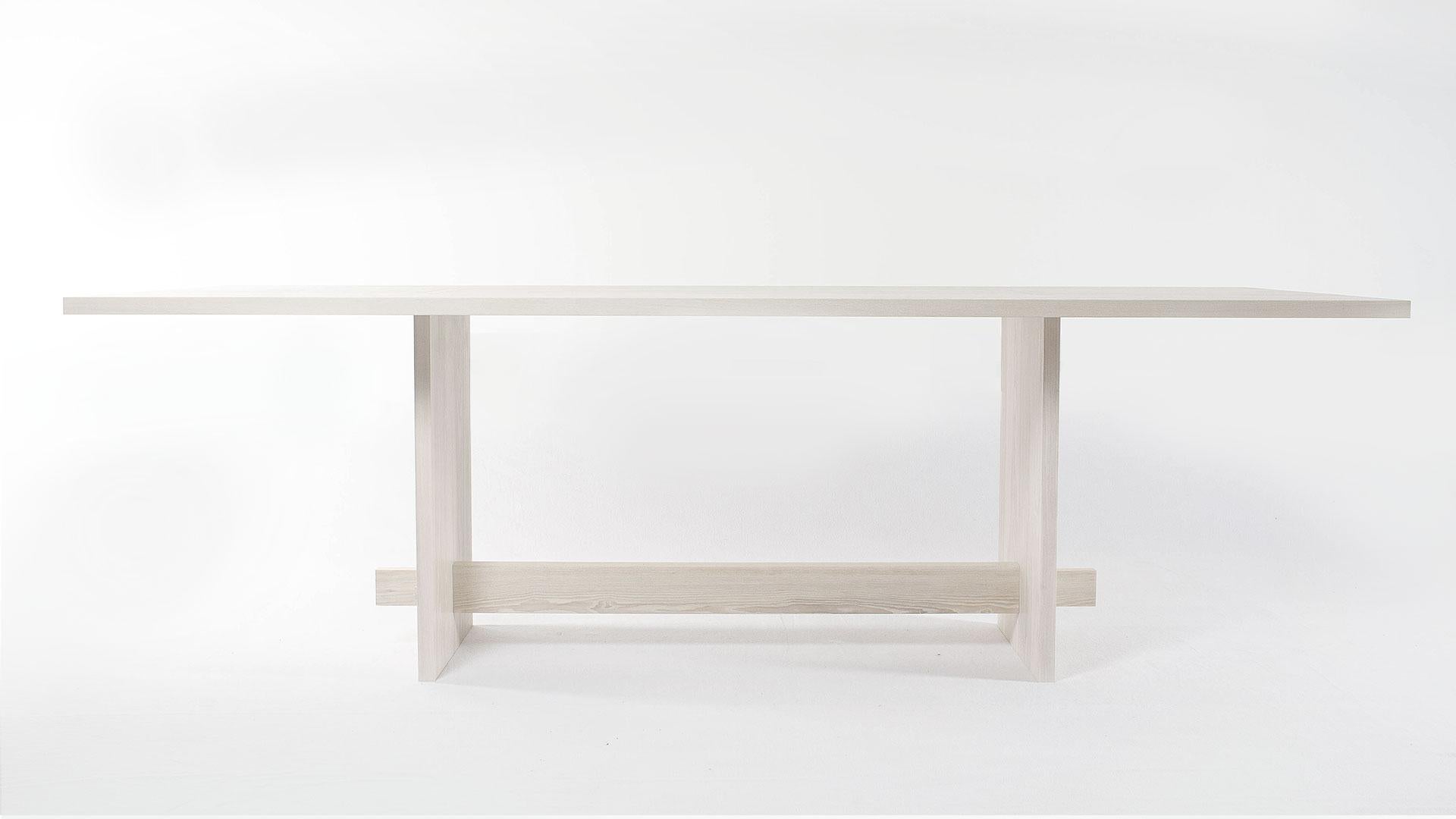Our Himes Table explores the principals of tension and compression. Each of the six parts that make up this piece fit into one and other and are held together using these forces of strength and stability. This table features a through tenon