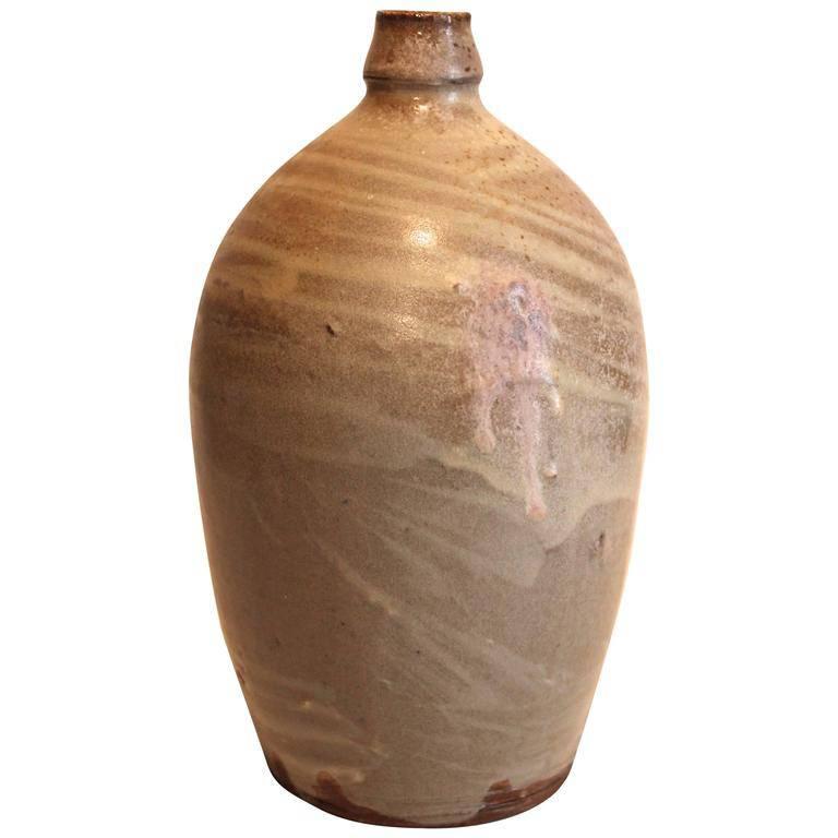 Beautiful hand thrown pieces by this important contemporary potter. The bottle measures 10 1/2