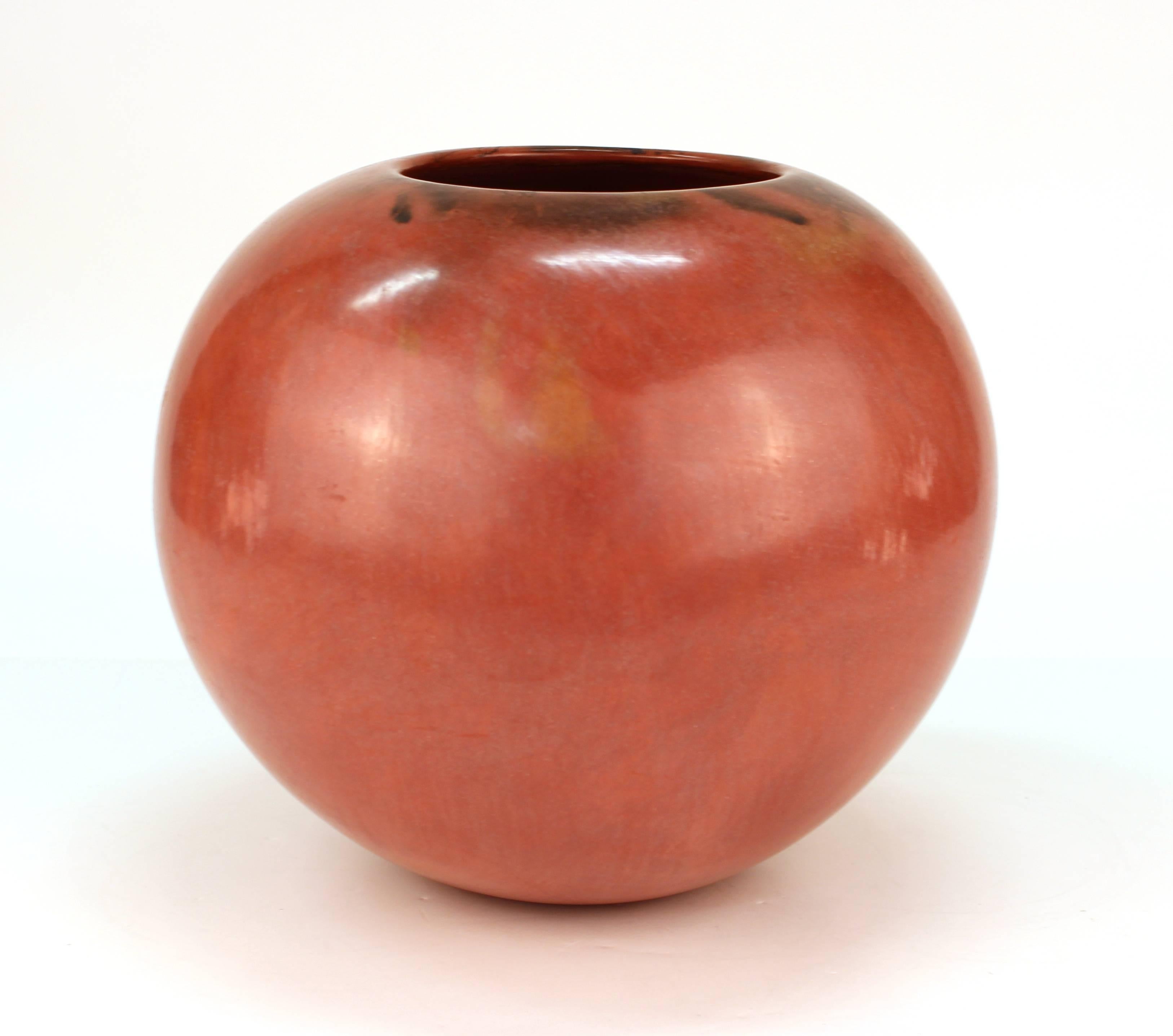 Mary Witkop (1948-2010) signed New Mexico pueblo Studio Pottery vessel in pomegranate red. The piece is signed and dated 1983 on the bottom and is in great vintage condition.