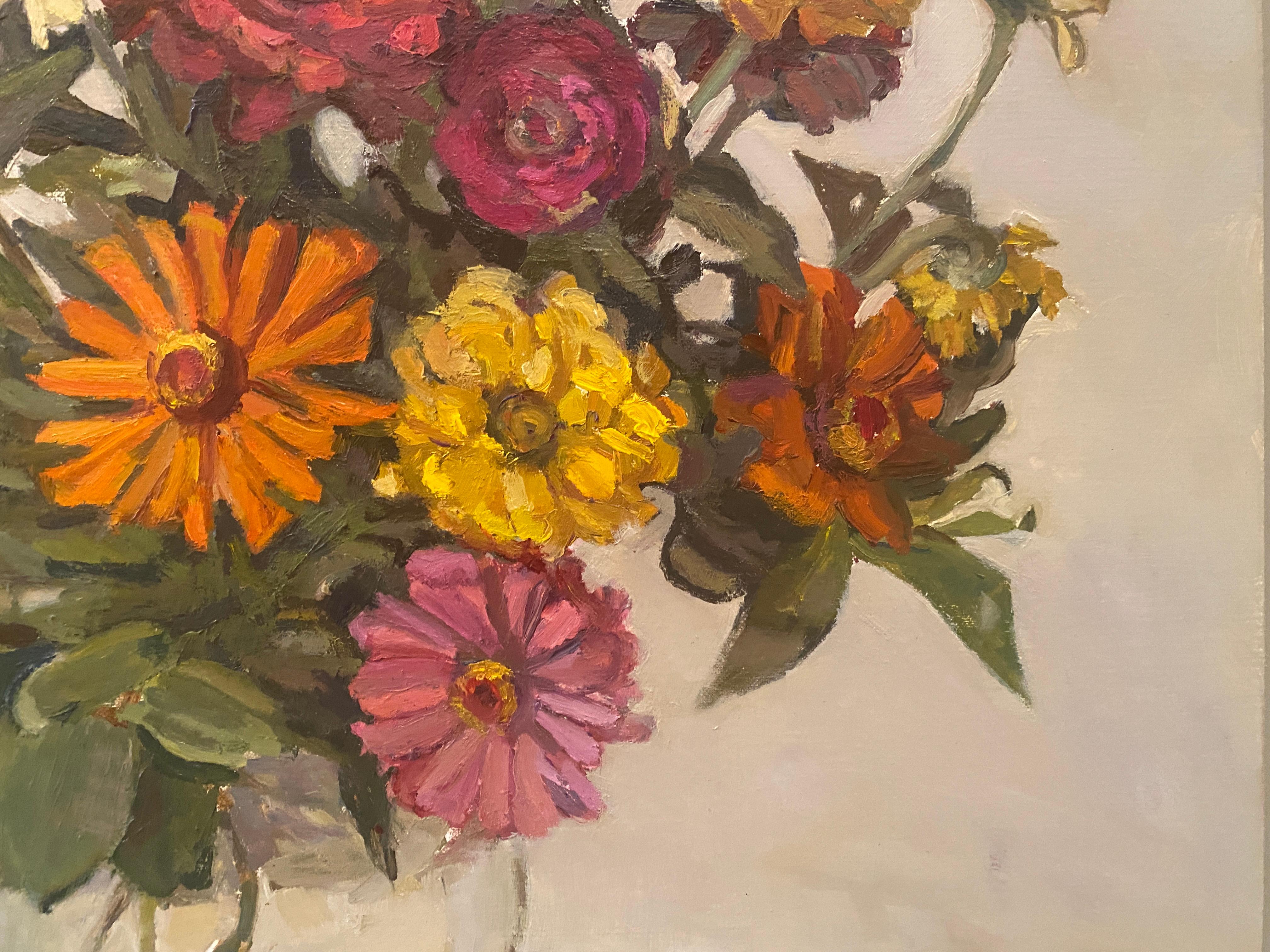 An oil painting of flowers, zinnias,  arranged in a round vase against an off-white backdrop. Framed in a white floating frame. 

Painting dimensions: 22 x 20.5 inches
Framed dimensions: 24.5 x 23 x 2.25 inches




Artist Bio
Maryann Lucas lives and
