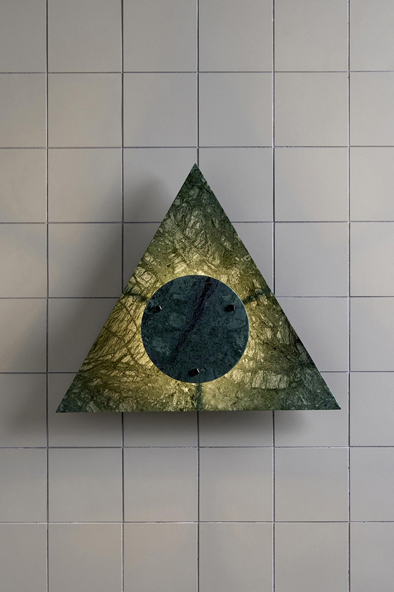 The Bermuda Wall Light range is a contemporary feature lighting design available in three earthy marble hues – Moss, Plum and White Carrara. The equilateral form allows the wall light to be infinitely tessellated to create an impressive centrepiece