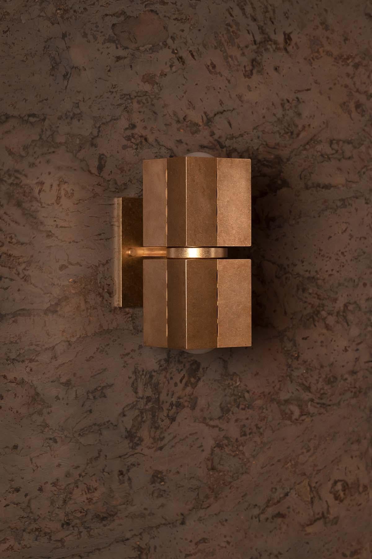 Drawing from Brutalist architecture and the symbolism of the North Star, Polaris is a collection that embodies both origins, by fusing geometric form and celestial illumination to create a collection of metal wall and ceiling lights. 
The Polaris