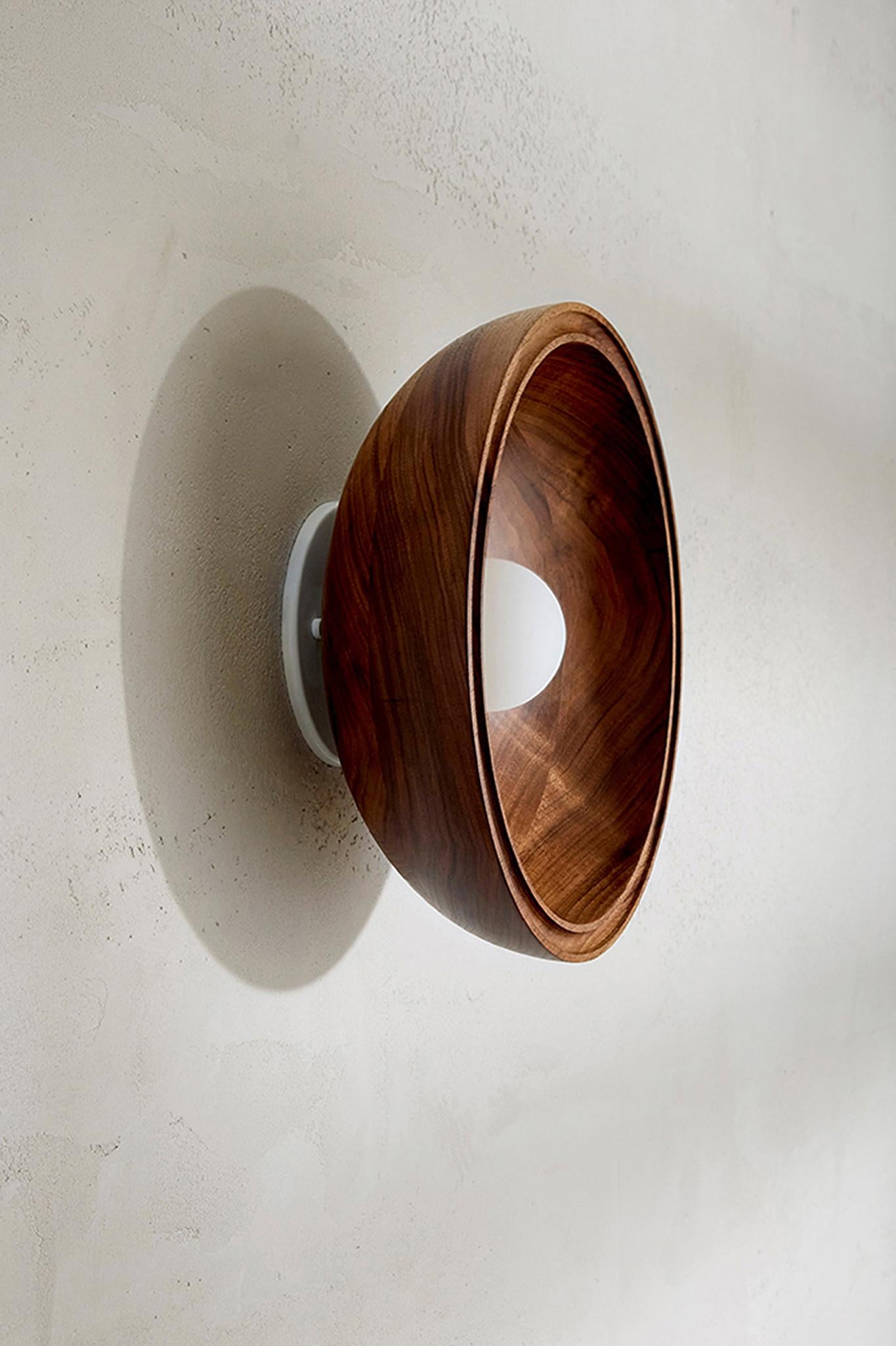 The Selene Surface Sconce has been inversely repurposed from the FSC-certified timber of our Terra 00 range. Suitable as a wall light or ceiling light in both residential and commercial projects, the Selene Surface Sconce offers a tactile warmth and